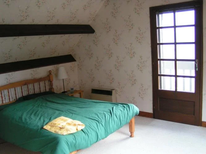 Front double bedroom with door to balcony