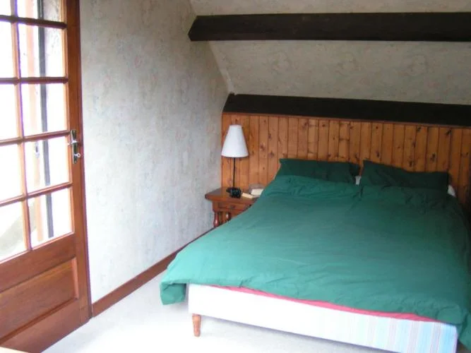Back double bedroom with door to upper garden terrace