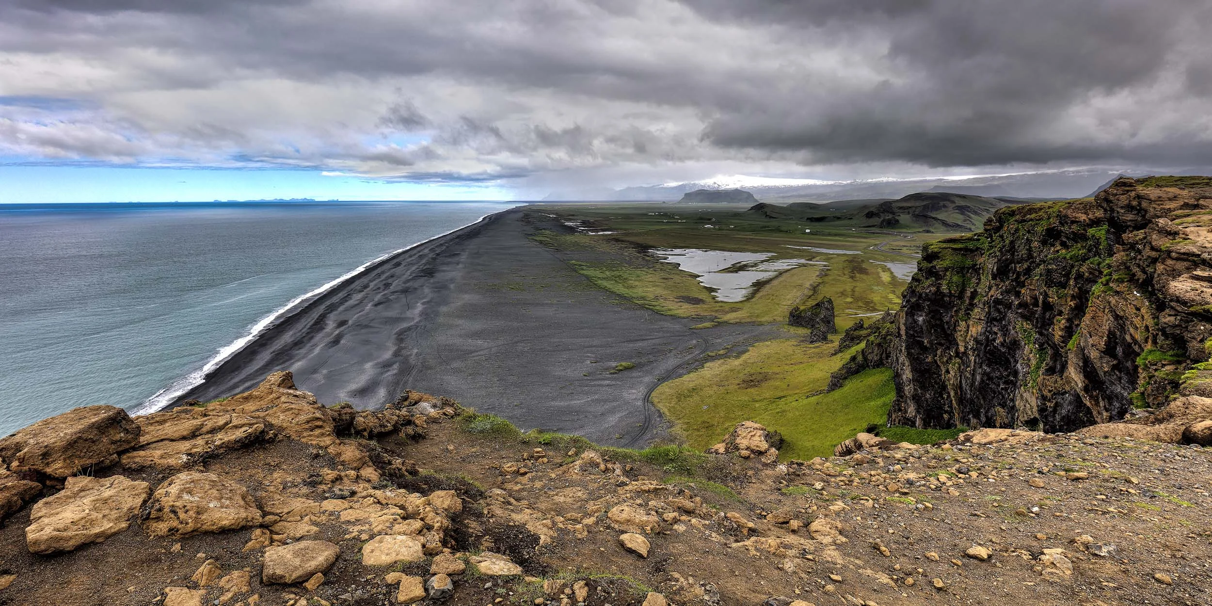 Looking out over the Black Sand Beach near Vik, South Iceland on the Atlantic Ocean coastline.