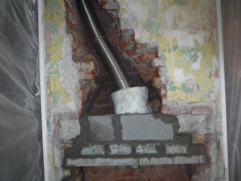 Fitted a new lintel with a larger gather to take a solid fuel stove.