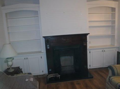 Completed room with new fireplace installed.