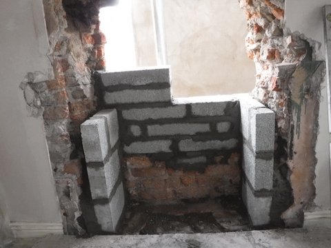 Surround for new stove in gable wall.