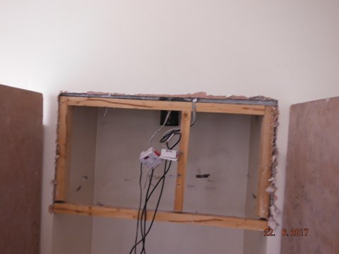 Wooden partition used to lower the stove opening.