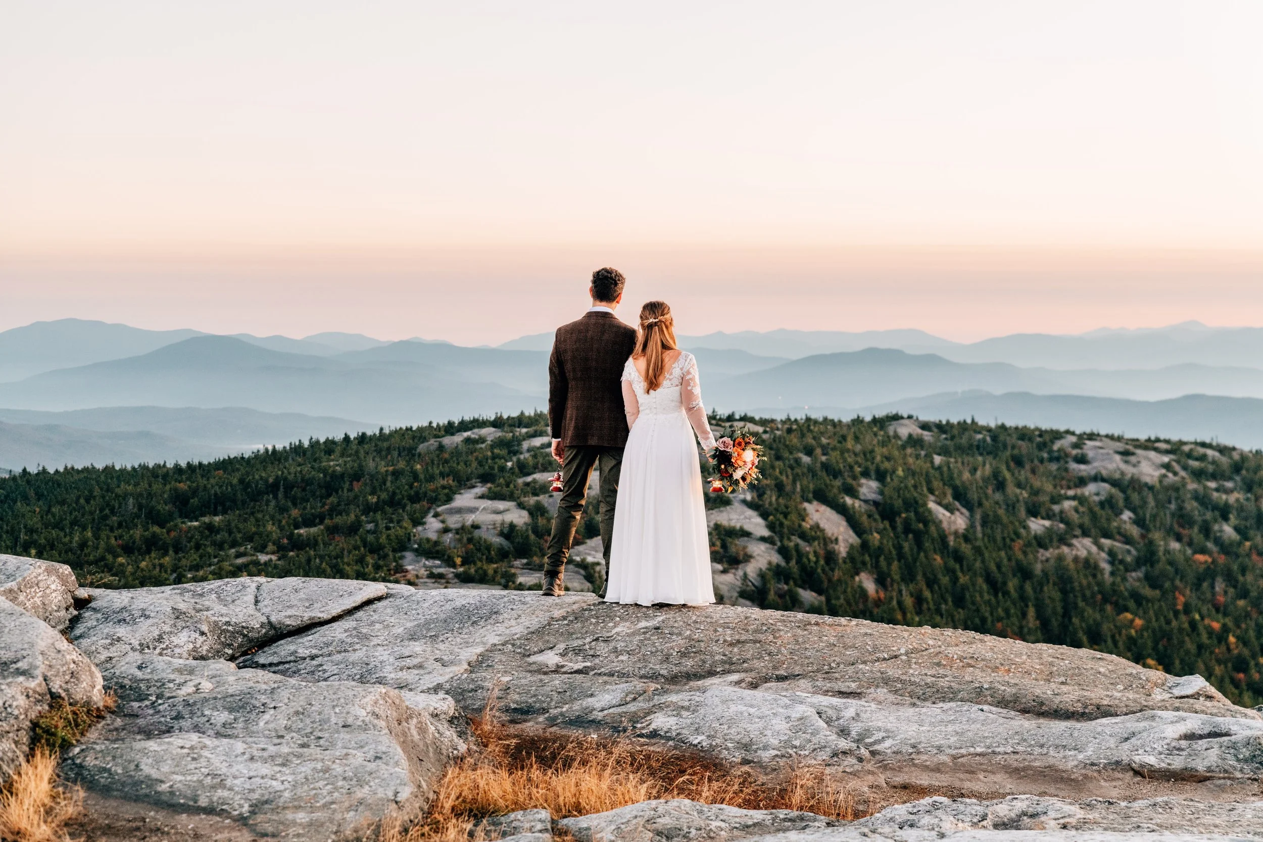Couple looking out over a mountain vista