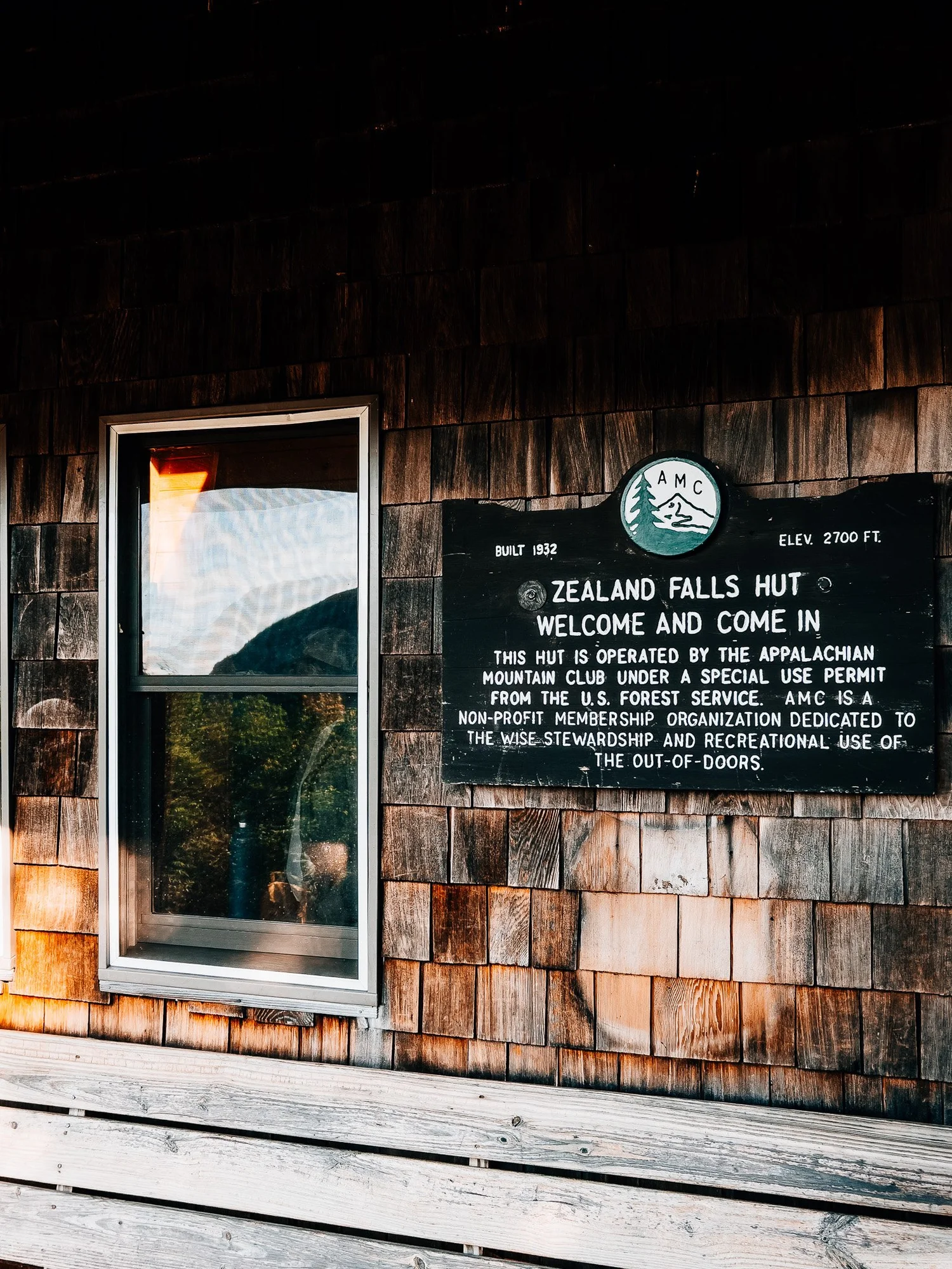 Zealand Falls Hut exterior welcome sign
