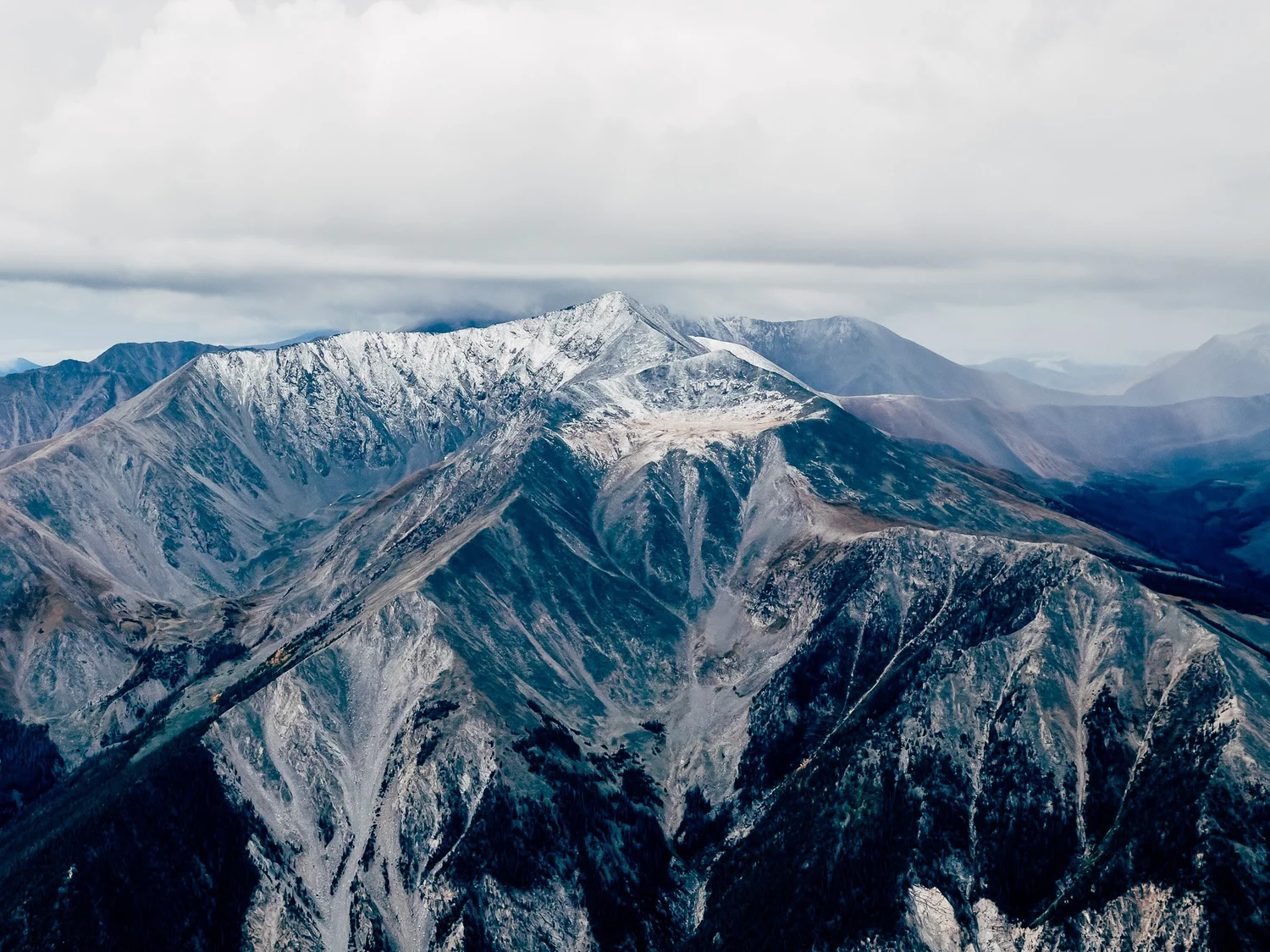 The ridge in changing storm light on the descent
