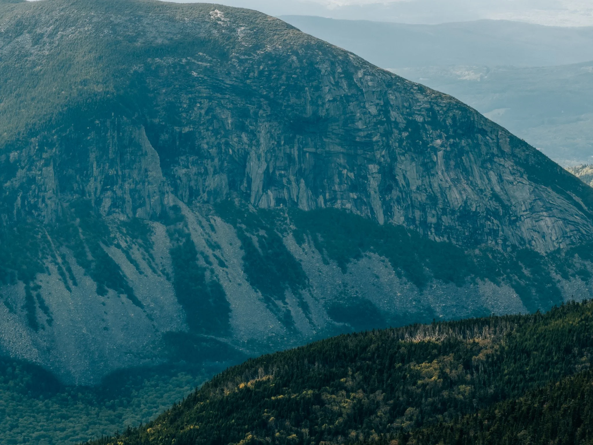 Cannon Cliff in hazy evening light to the west