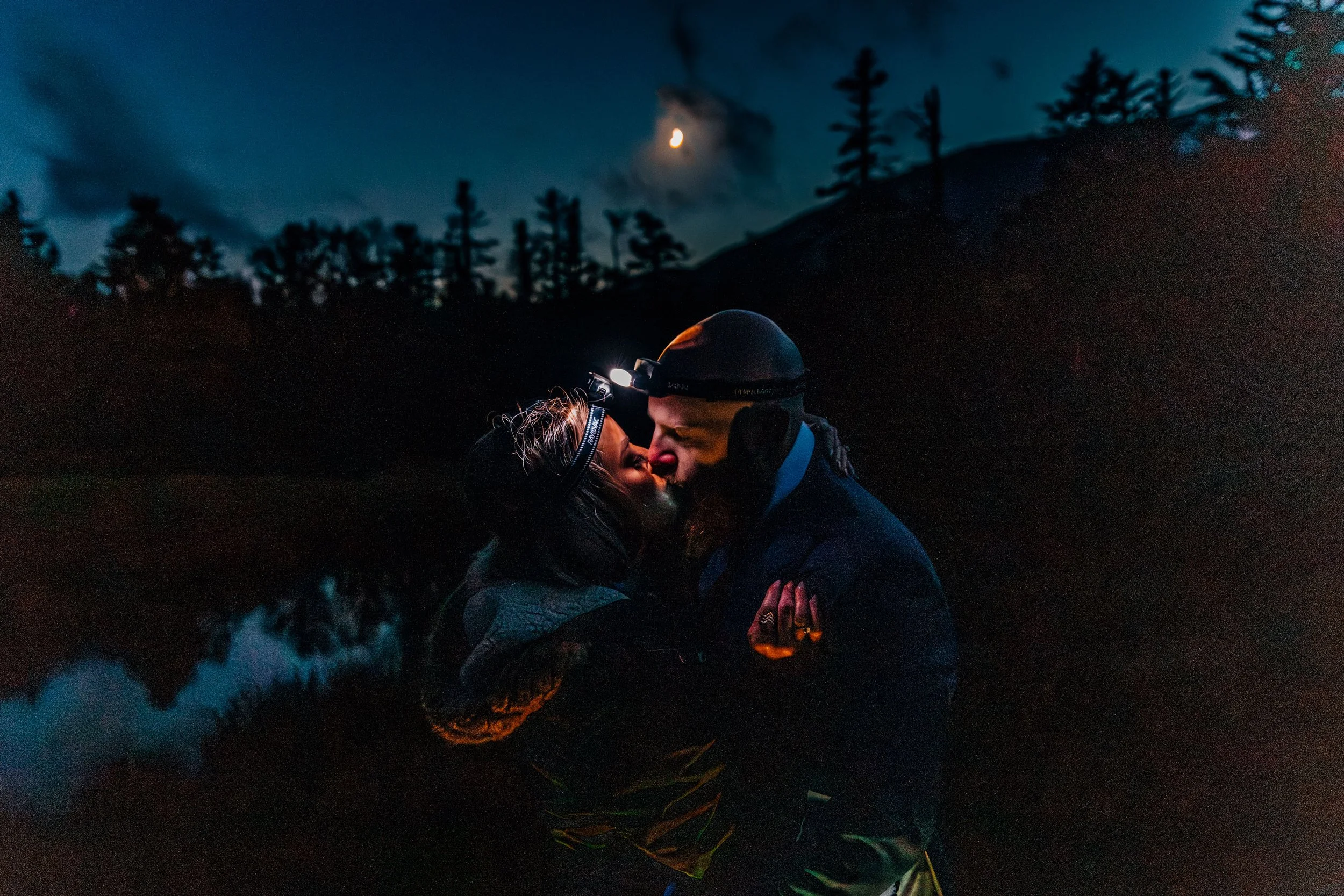 Couple kissing in the evening after their elopement in the White Mountains of New Hampshire