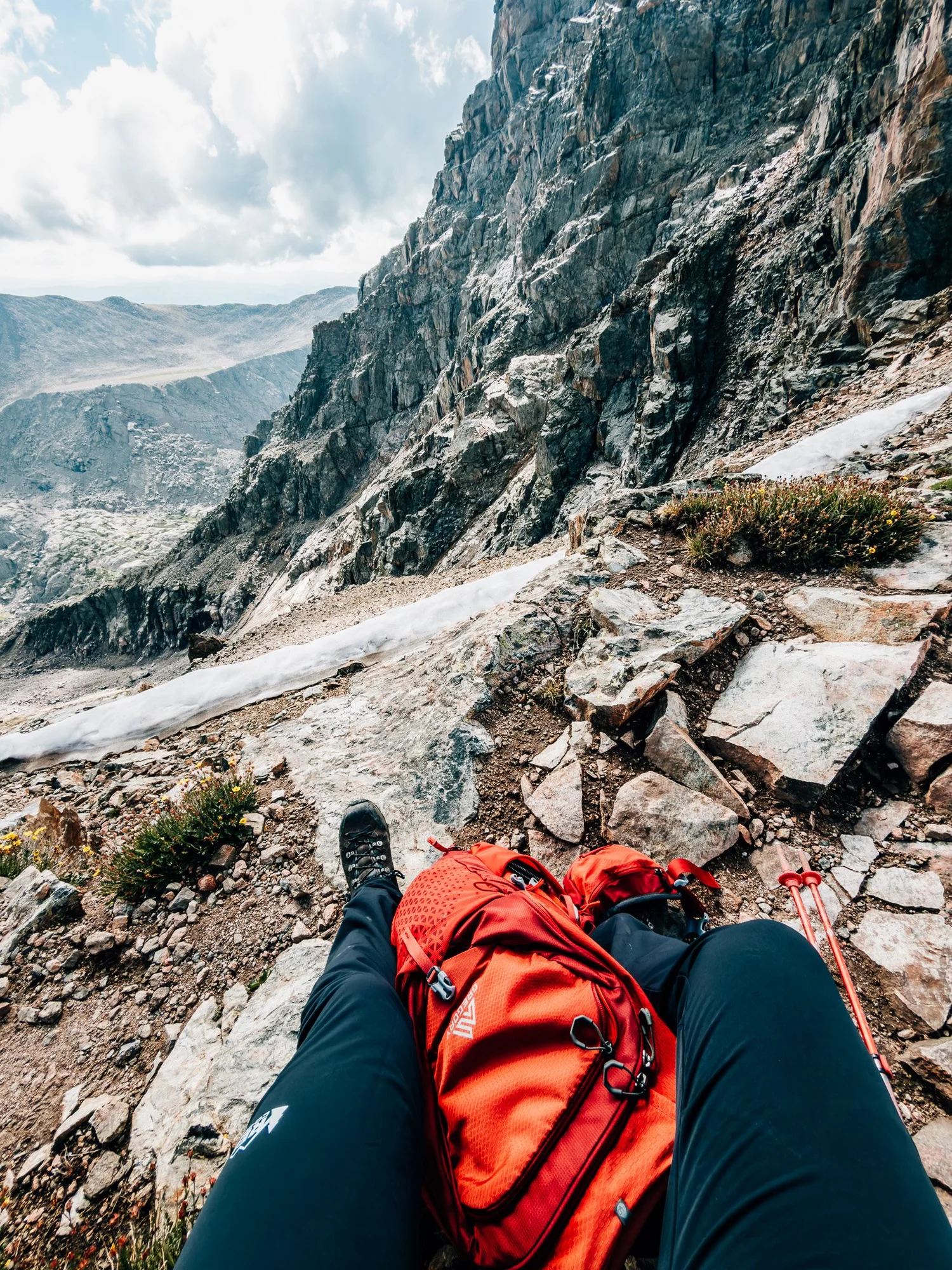 Break before the final summit ascent with a small snow cornice lingering into midsummer