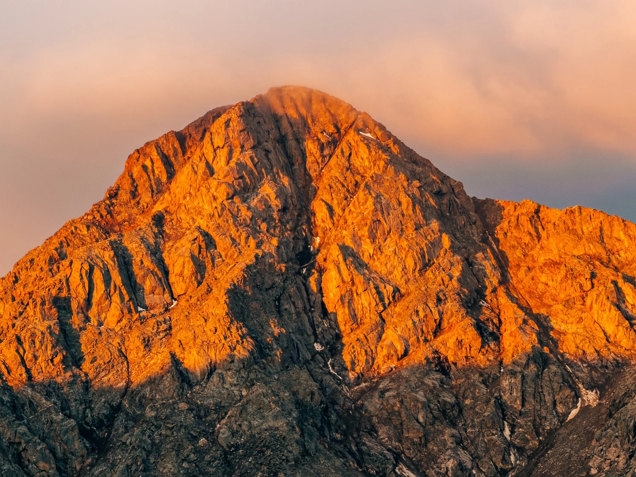 Mount of the Holy Cross glowing orange in alpenglow