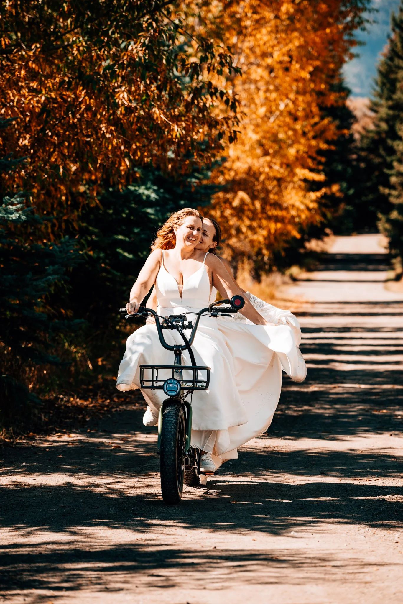 Couple cycling along a scenic road near Jackson Hole Wyoming