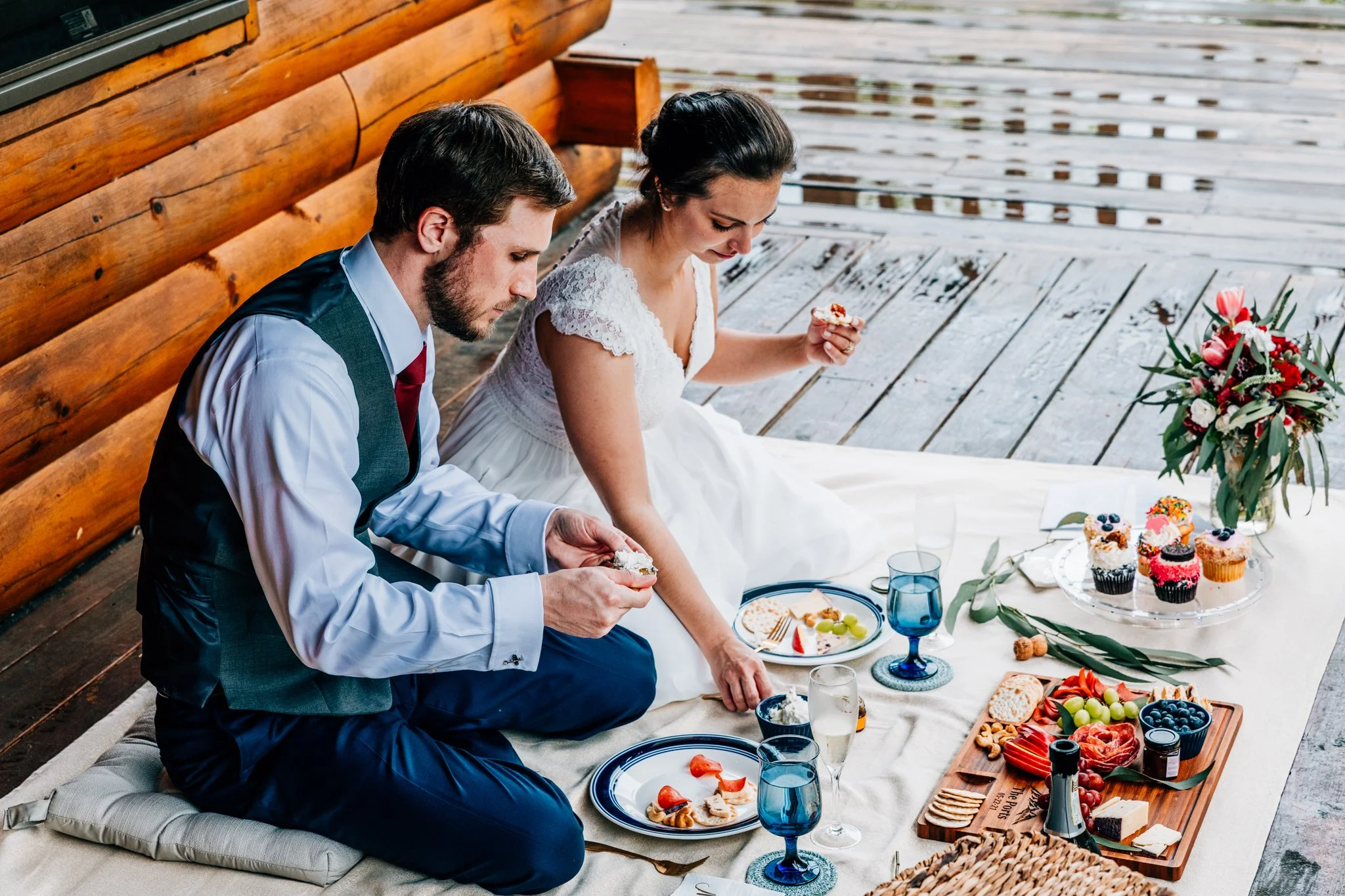 Couple celebrating after their mountain elopement at a cozy local Airbnb in New Hampshire