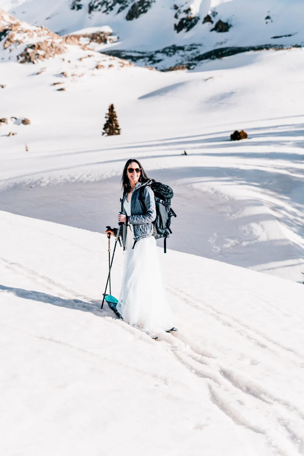 Bride in wedding dress at Mayflower Basin during a Colorado ski elopement