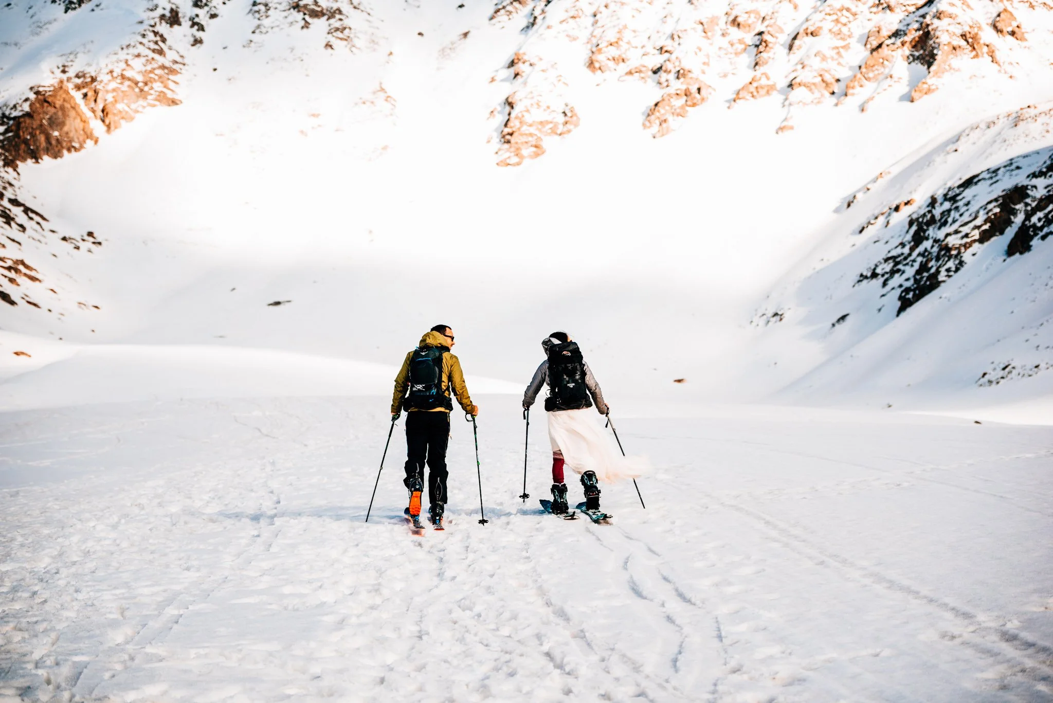 Couple skiing together during their Colorado ski elopement