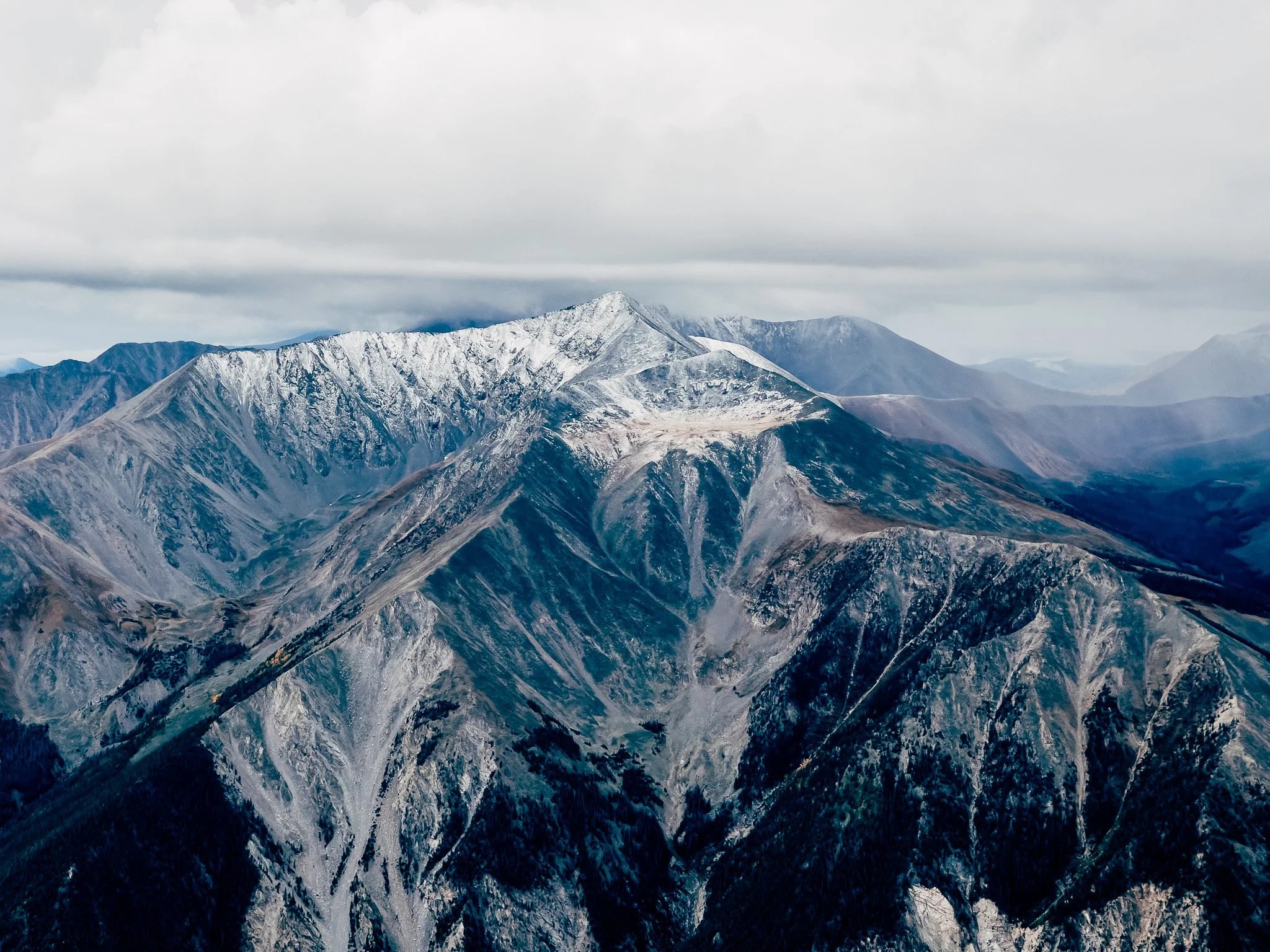 Snow-dusted ridgeline of Mount Princeton under a heavy sky in the Sawatch Range