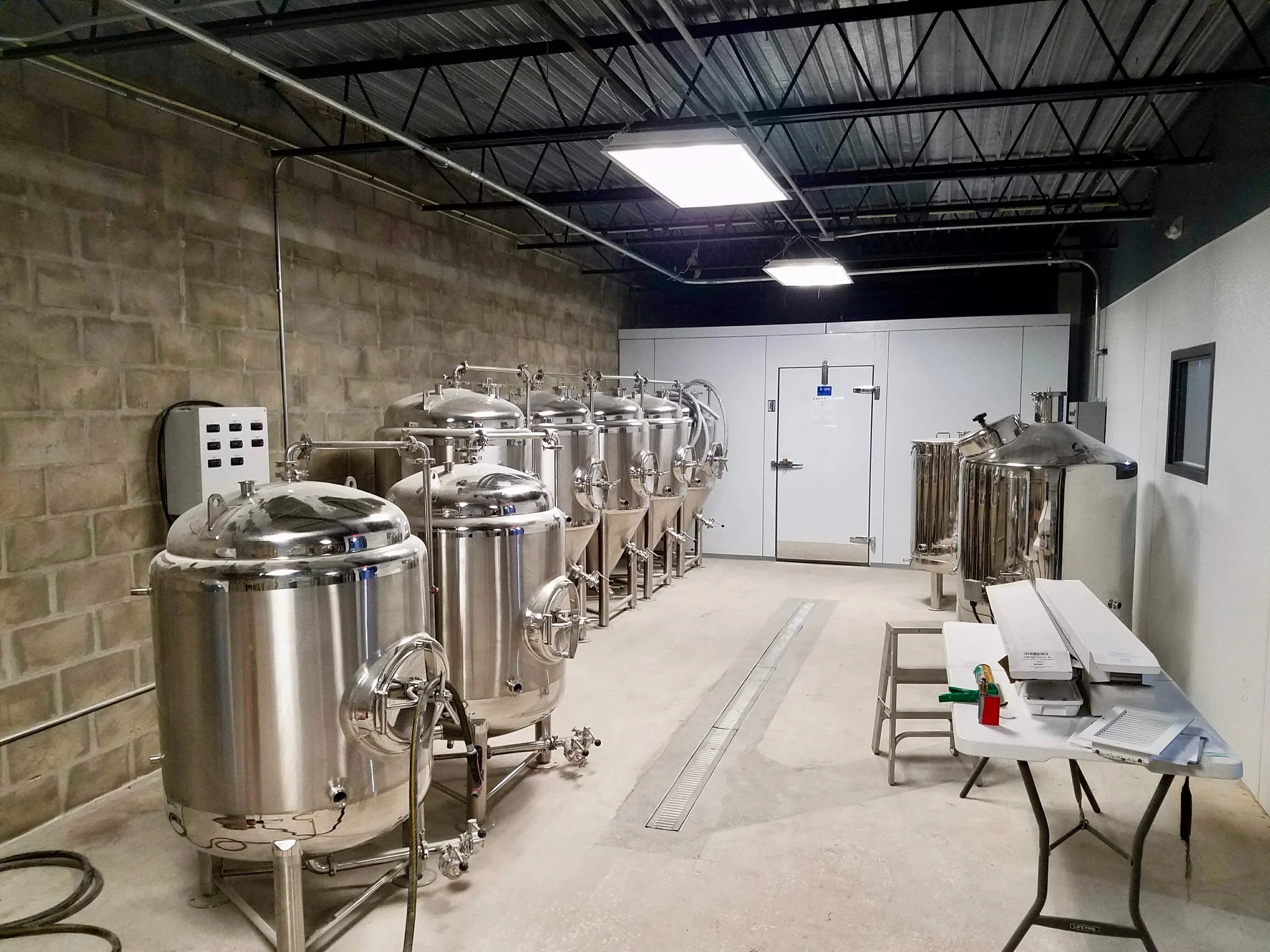 the brewery includes a 3 barrel system and a walk-in cooler.