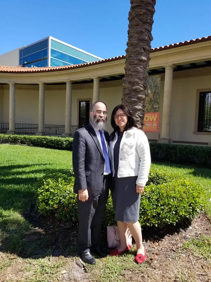 Rabbi Alter Korf and his wife, Chaya Korf, in front of the Museum of Fine Arts in DOwntown St Petersburg