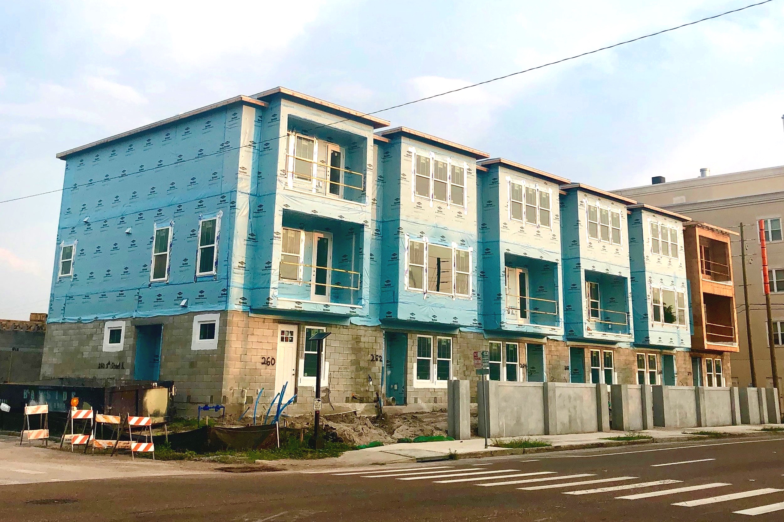 Two of the project’s four buildings are under construction and the building that fronts 8th Street has already topped out. Photo taken July 11, 2019..
