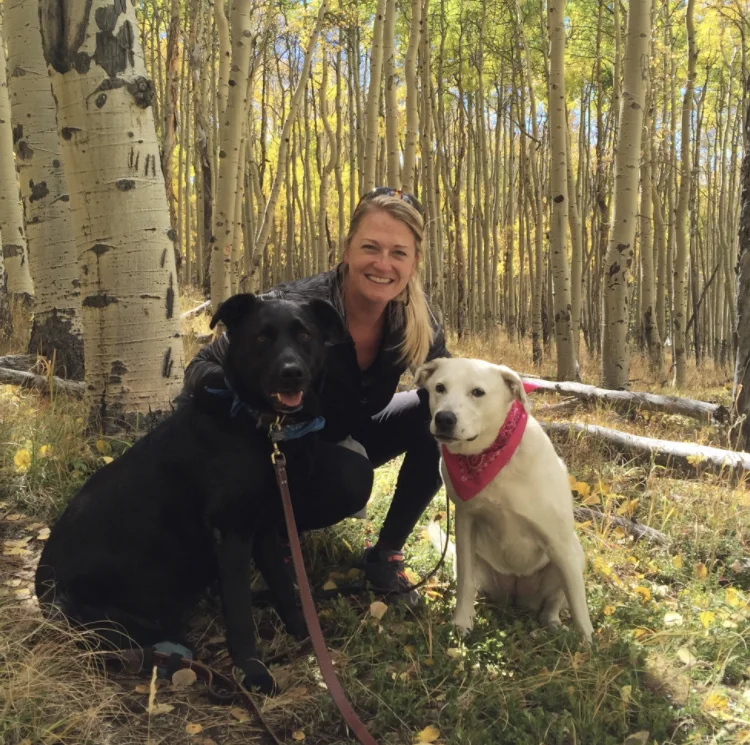 Owner of Book + Bottle, Terra Dunham, and her dogs Apollo and Stella