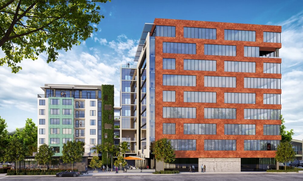 The eastern facade of the building is wrapped in a burnt orange metallic skin, paying homage to the district’s industrial past.