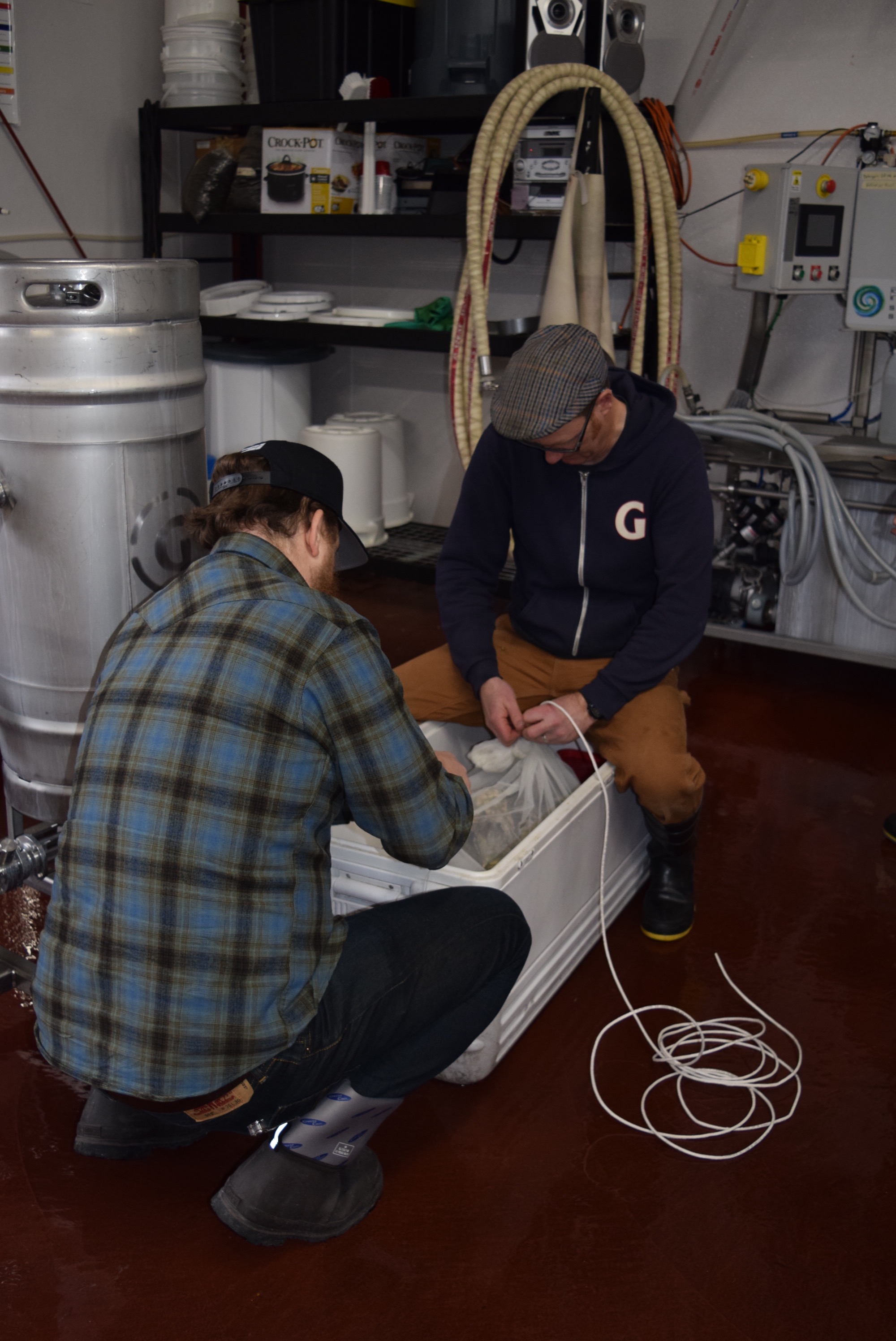  Ben and Van preparing mesh bags used to contain the oysters to be added to the boil. 