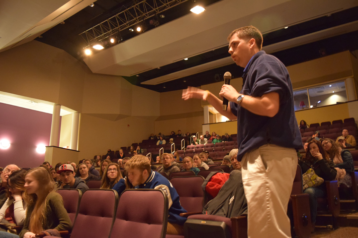Buckhannon-Upshur High School Teacher, Brent Kimble, asks the panel a question on behalf of the 17 students that attended this event.