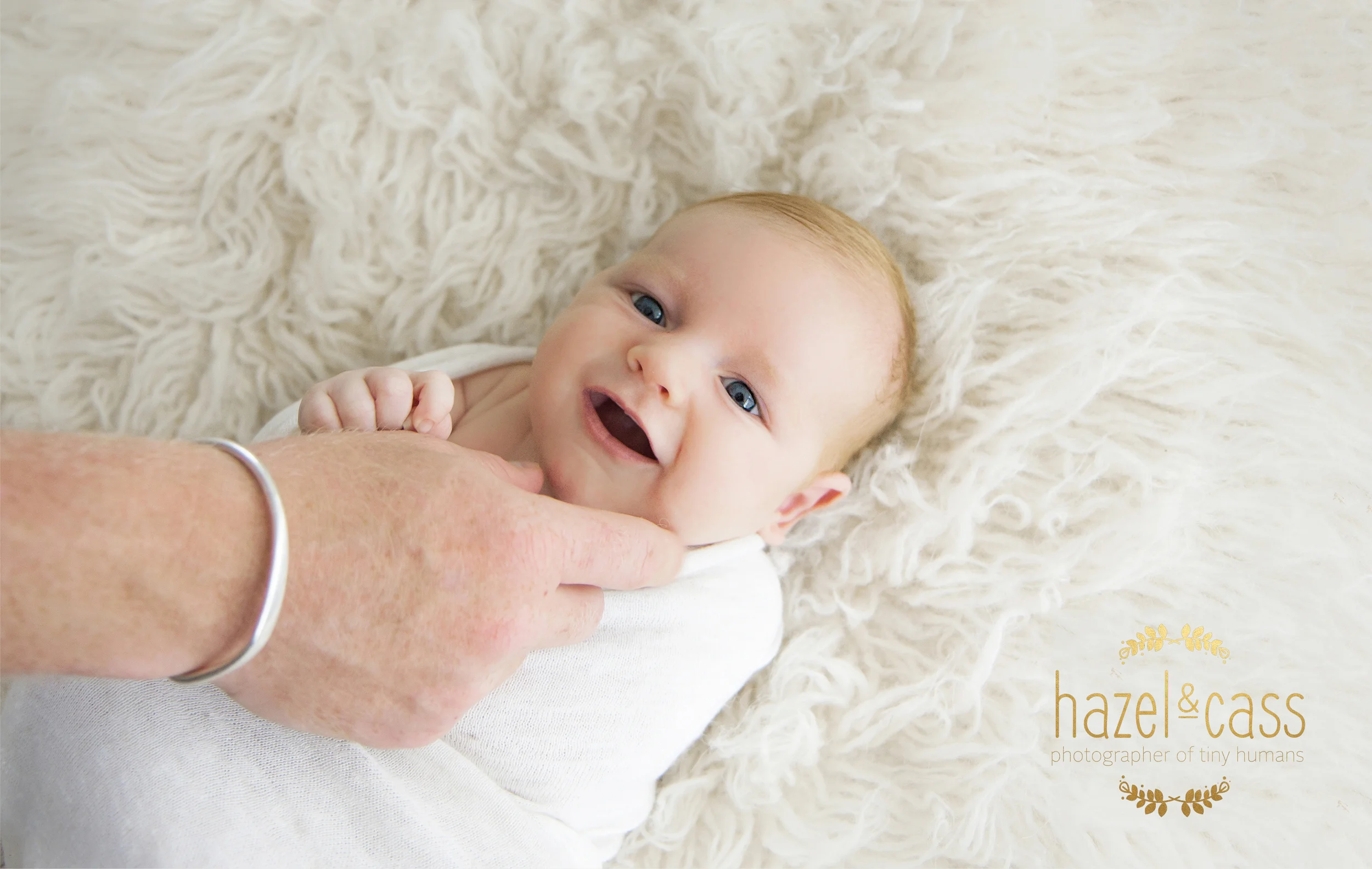 Daddy giving him a little tickle. 