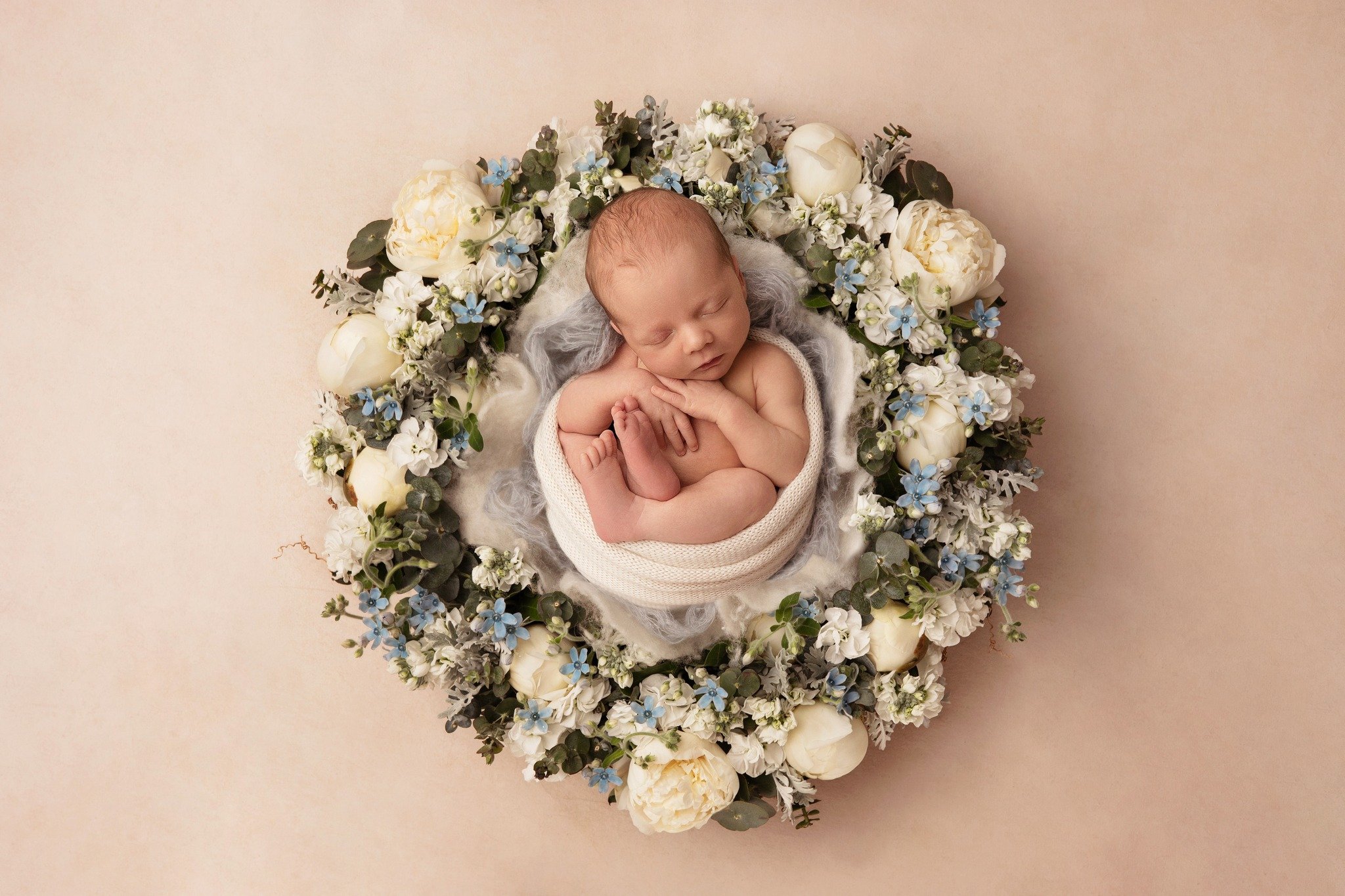 I often have people ask if we do flower wreaths for boys as well as girls, and my answer is a resounding YES. If I could go back in time and get just one newborn photo of my own son - this would be it. 

What in the world could be more beautiful that