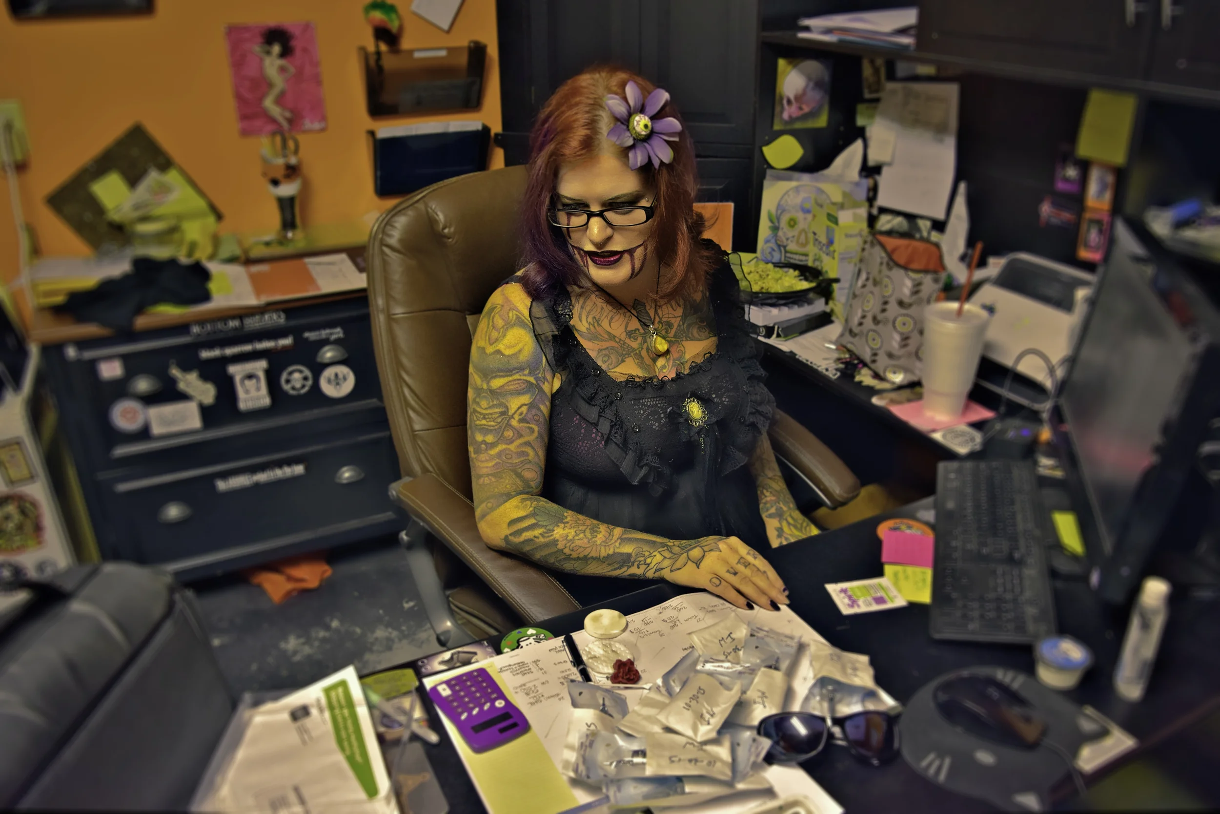 A busy Cora working on Halloween, scheduling face paint session in addition to regular business for her two shops. What makes you the most sad? "In today's society, the thing that makes me sad is the general lack of work ethic in today's society, everyone is 'holding out for management' without realizing that you have to earn it, you have to build the characteristics management requires before you will earn that position." 