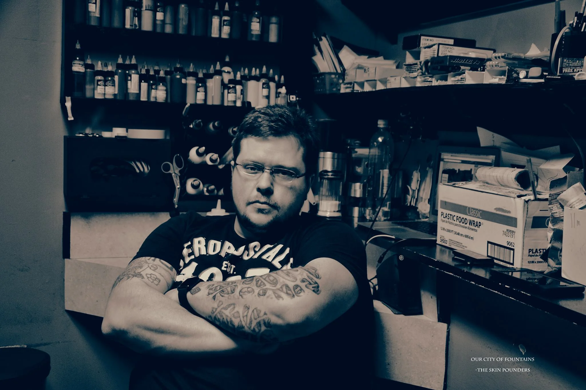 Years ago Fred "Falcon" Sibary owned some of the most successful tattoo shops in Columbus. After dominating 6 years in his downtown location, the city decided to change the ordinance, forcing him to have to move his business off of Broadway. "After being there for 6 years with no problems I didn't think that it would be that difficult just to move across the street, but when I did and went to g et my license...found out they had changed the zoning and there were no more tattoos studios allowed to open on Broadway." - Trevor, Falcon's son, is continuing the family tradition. - "My dad started tattooing in 1970 in Detroit. He came down here in '84. I've pretty much seen it all. I've been around it all my life. Tattooing is what fed me as a kid and now it's feeding my kids. My dad had a stroke, then found out he had a detached retina so he took a back seat to it all. It was sad. You know, this isn't a career...it's a life. We don't have 4O1K's, retirement and insurance. You don't get a gold watch after your twenty years. That's probably the hardest thing to realize being in this business. If you aren't smart from the get with your money, you realize you're fucked at the end of this. Everyone wants to get into it because they think it's cool and make millions but, my back hurts...my hands hurt...we have horrible diets. We deal with all types of people." - How hard is it to change with the business? This business is constantly changing isn't it? - "The biggest changes have already happened. Back when I was a kid...no one in any shop wore gloves...they didn't do the sterile thing the way we do today. Hell my dad would tell me stories...he was there for the first ever Sturgis. They would have people lined up for tattoos. And it wasn't like there were 50 million setups or whatever it was like one little place on the corner. They would have ink in baby jars. You come and sit down, they'd pull a rag out with soapy water, wipe your arm down and go to town. Artists would smoke while tattin' your arm too. I guess that's why back then tattooing developed a stigma for it being dirty and getting diseases. Nowadays, they'd shut you down if you don't take the proper precautions. We have disposable one time use needles. Customers will always have their eye on you. I make sure every customer watches me open up new needles. If I'm set up before they get here, they don't like that." - It's amazing how far this industry has come, however I bet the reasons people get them never changes. - "The funny thing is, most people who come in to get tattoo's need a momentary life change, or they want a 'WOW' moment. Maybe they want to be rebellious...whatever the case may be...this is our every day. Their 'wow' moments are our every day."