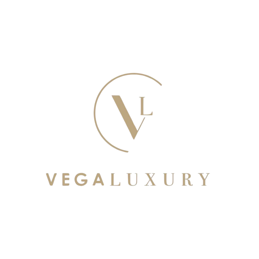Logo for Vegaluxury featuring a stylized letter V and L inside a partial circle with the name 'Vegaluxury' below.