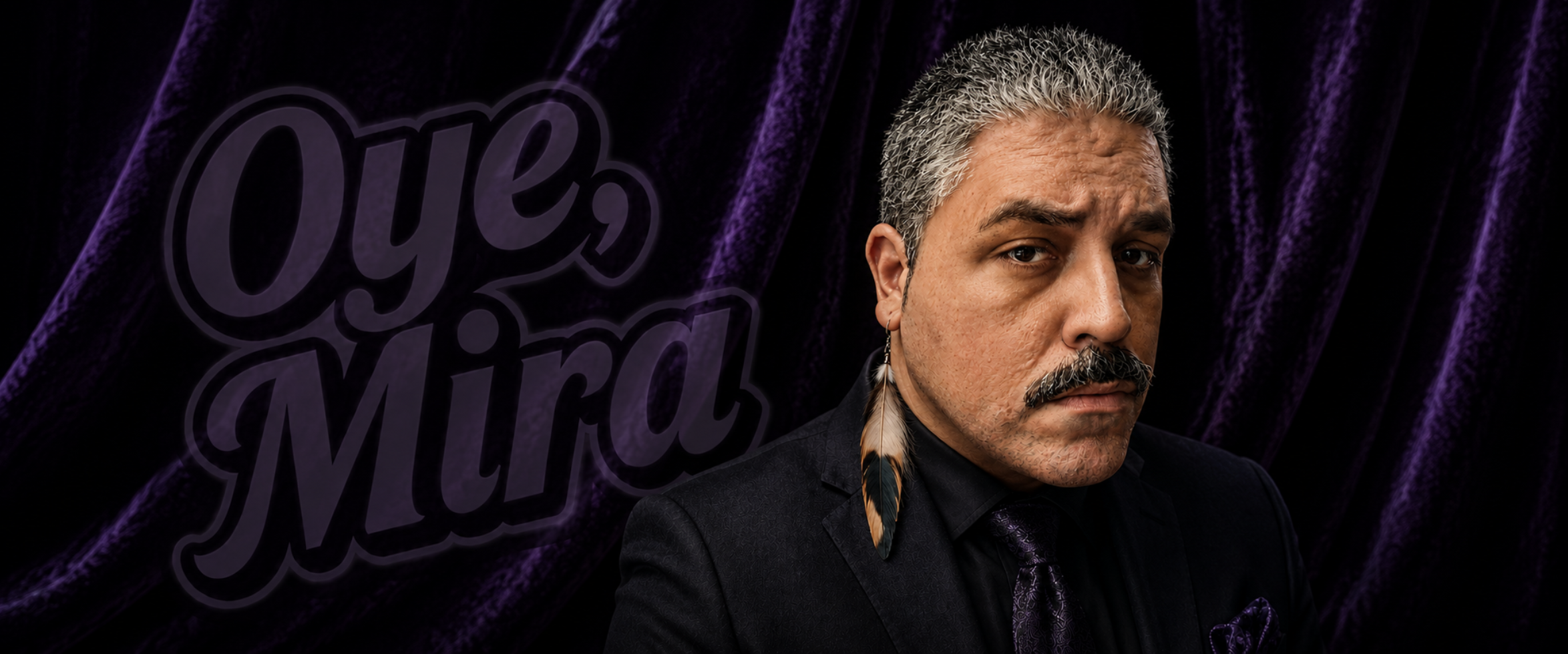 Christian "ZacaTechO' Ortiz in a black suit and purple tie. He has a feather earring. He's standing in front of a purple velvet curtain with the words Oye, Mira in the background