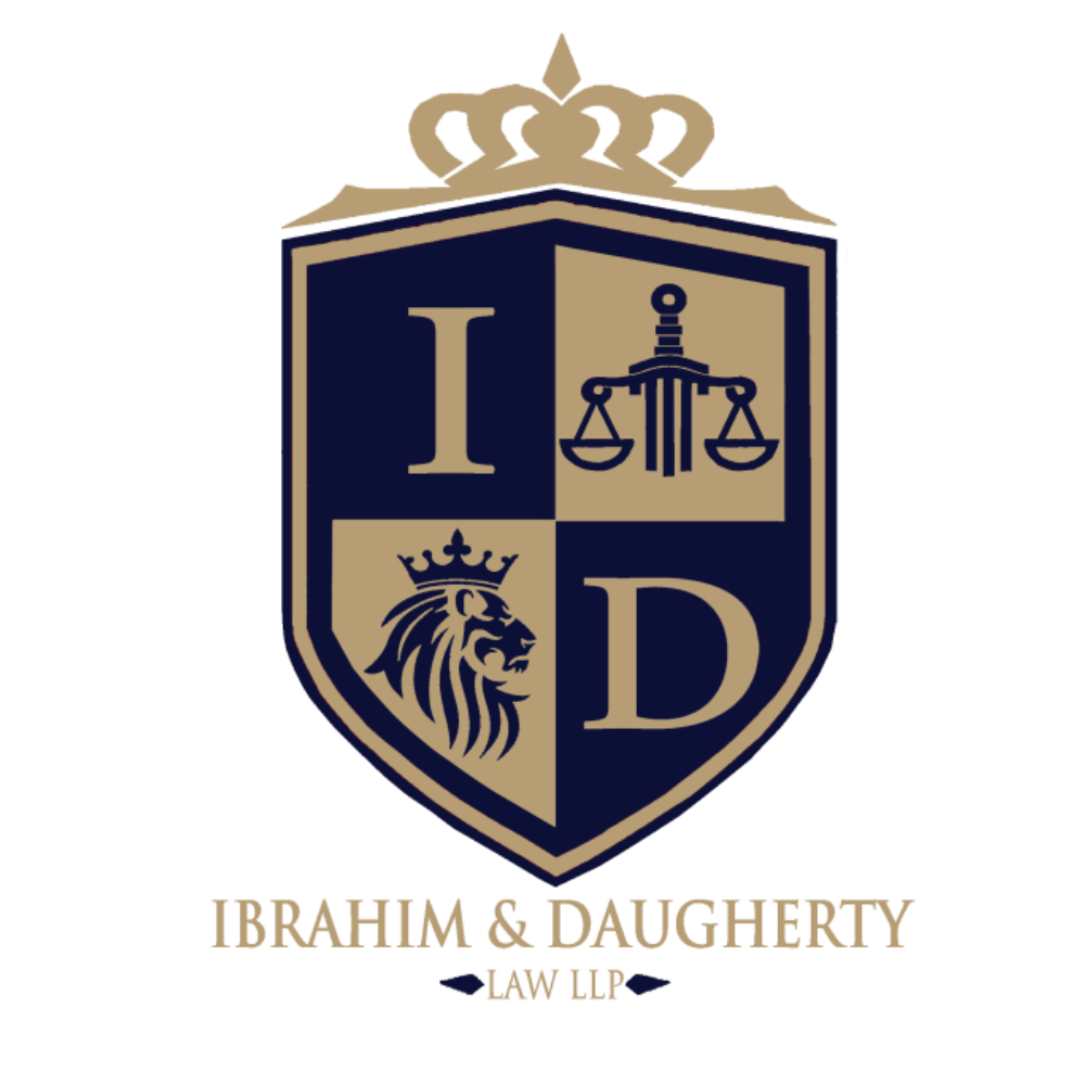 Law firm logo with a shield divided into four sections, a crown at the top, a lion in the bottom left, scales of justice in the top right, and the letter D in the bottom right. Text below reads "IBRAHIM & DAUGHERTY LAW LLP."