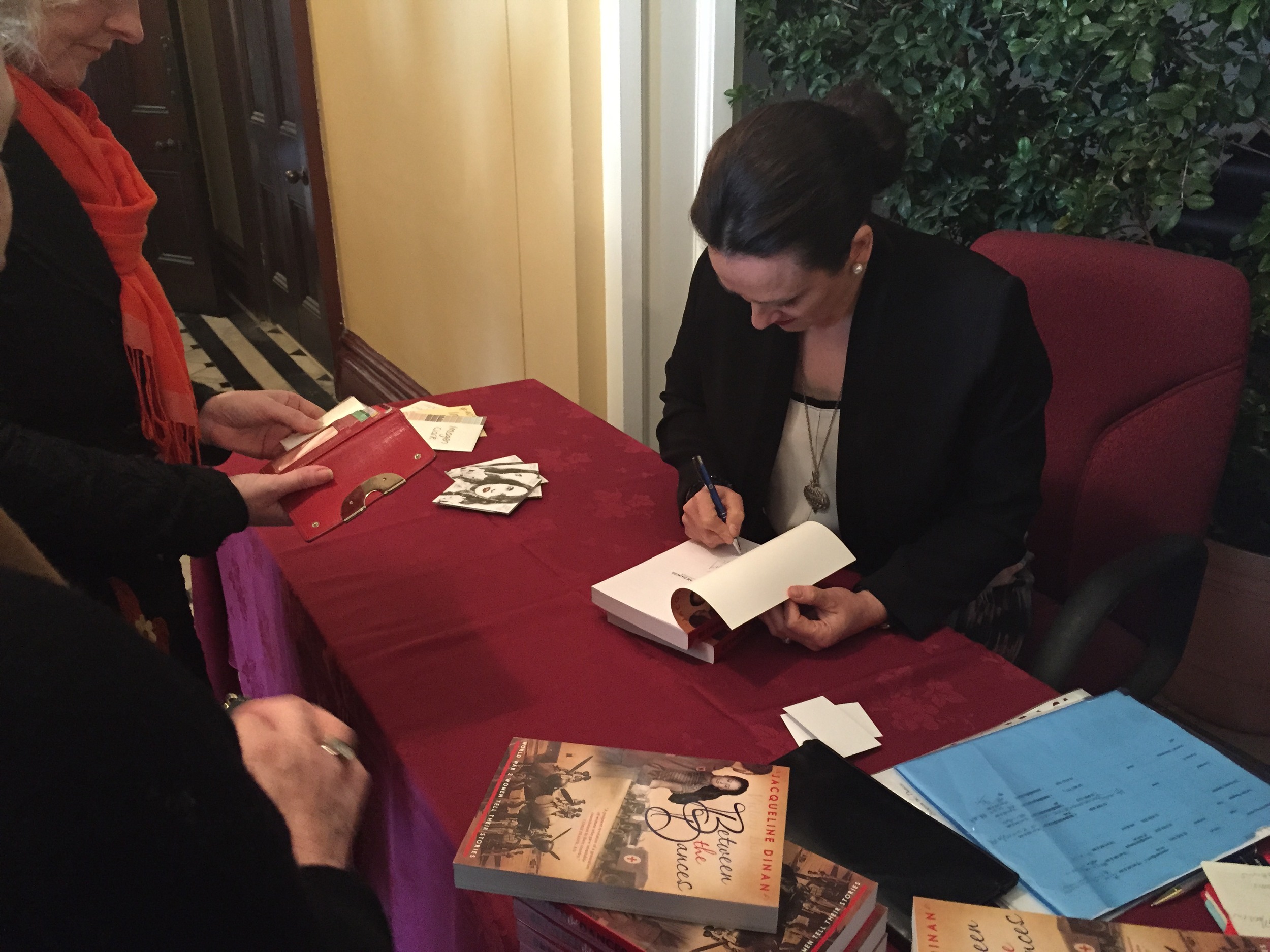 Jacqueline Dinan signs books at the Sydney launch of Between the Dances