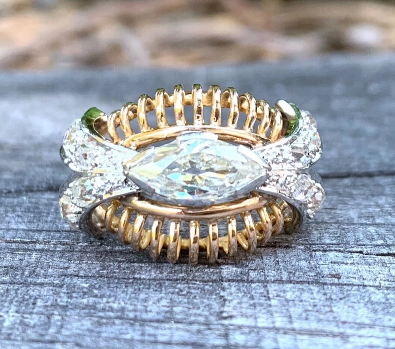 "La Polochon" Bague ancienne en or rose, platine et diamant navette