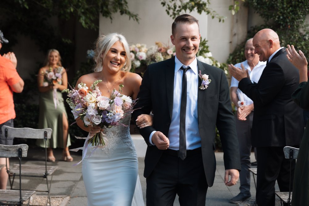 bride-groom-walk-down-aisle-eva-bradley