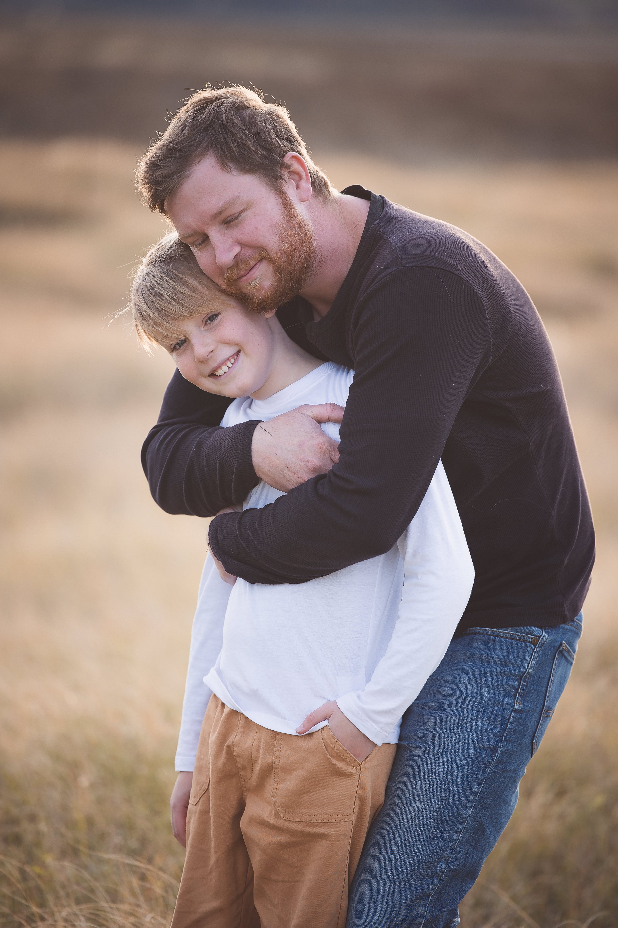 father-hugs-son-hawkes-bay-photographer