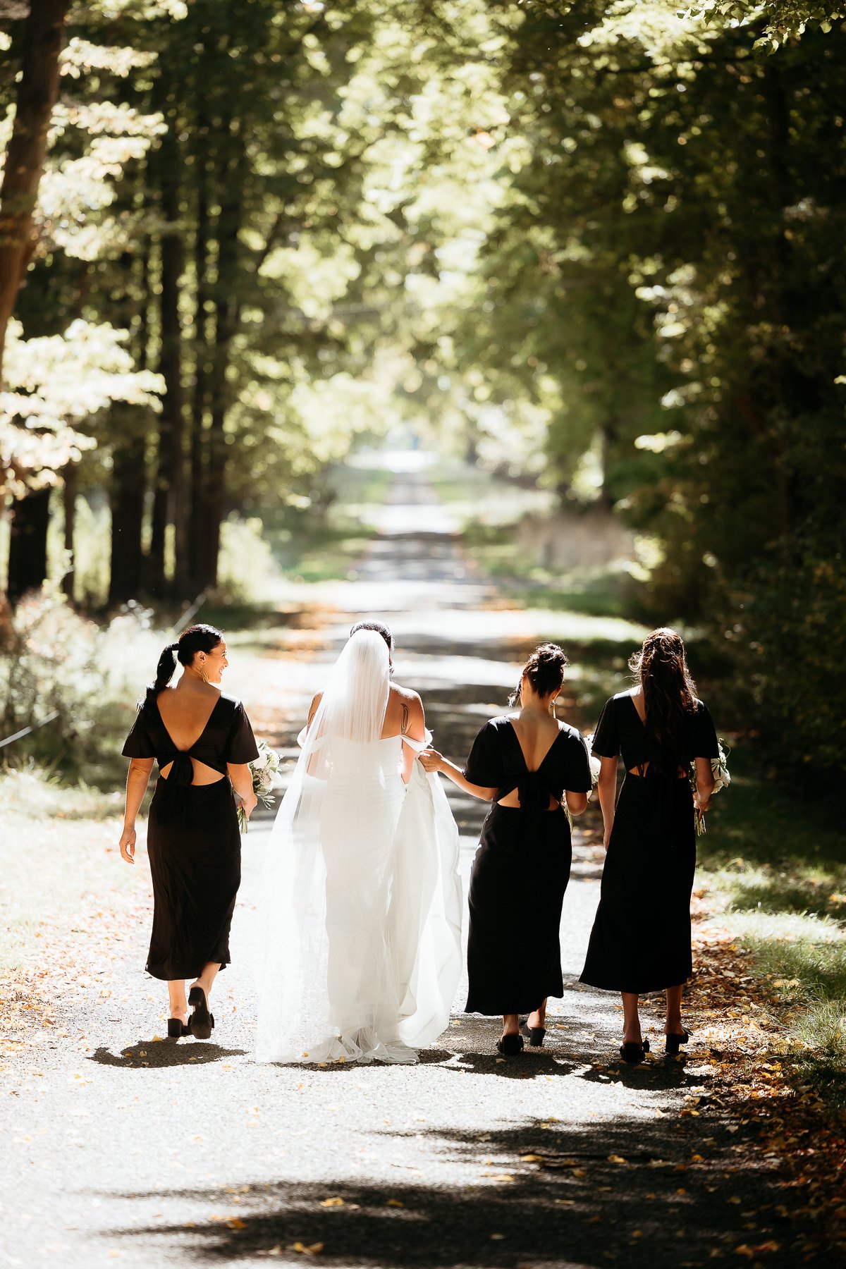 bride-and-three-bridesmaids-walking-away-at-hawkes-bay-wedding