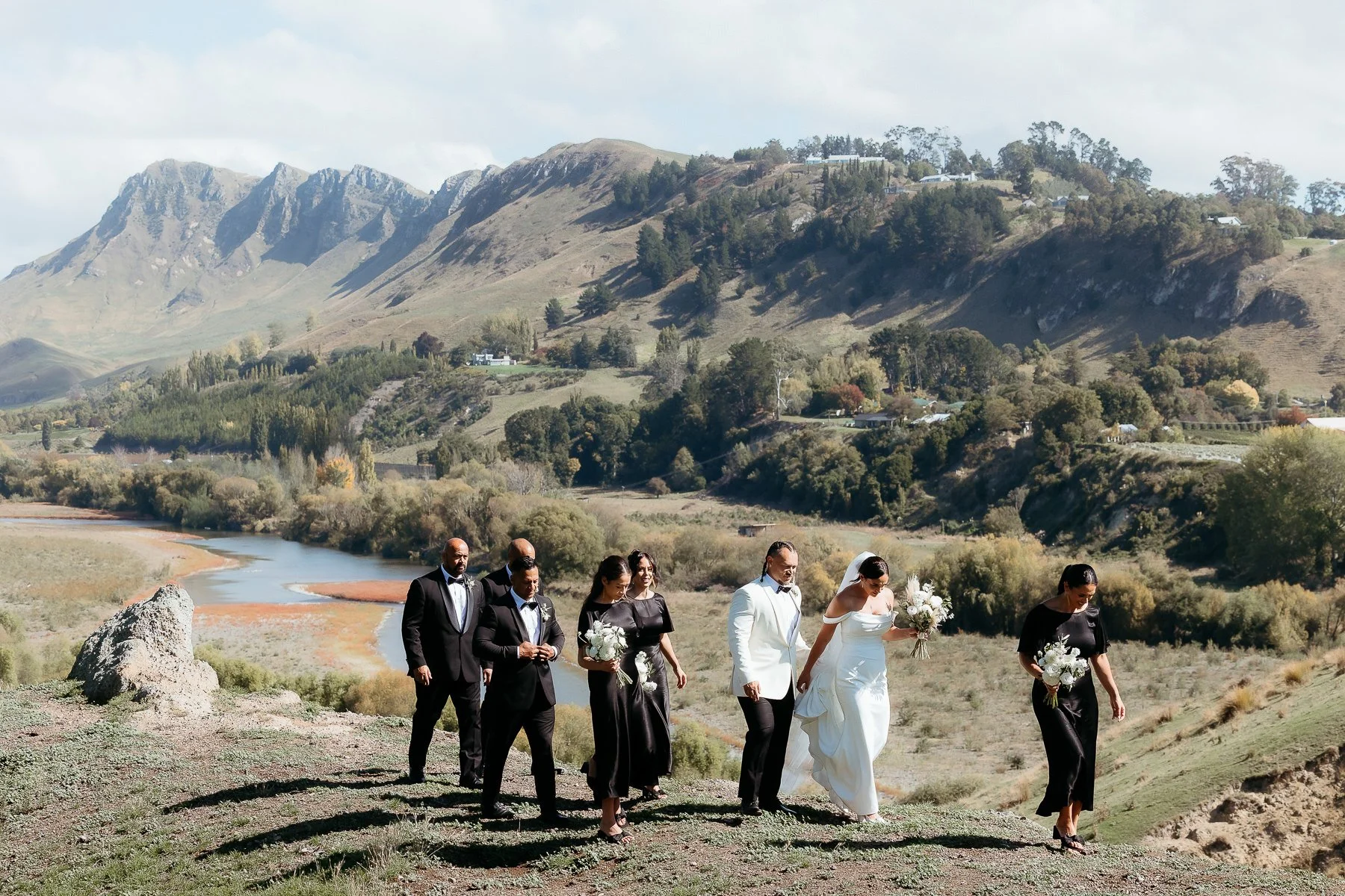bridal-party-walking-along-tukituki-river-valley-hawkes-bay-wedding