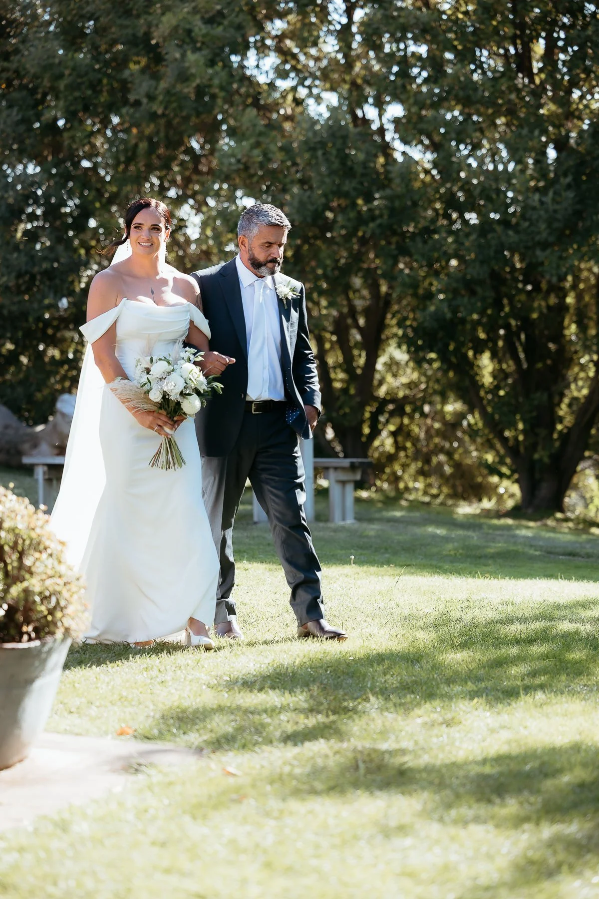 bride-walks-down-aisle-on-fathers-arm-hawkes-bay-wedding-venues