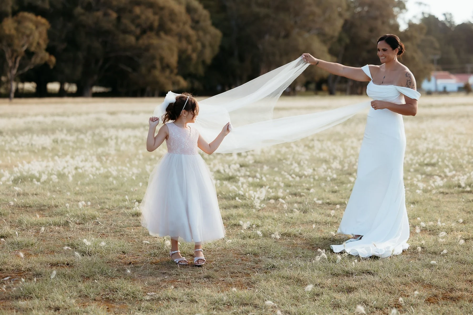 bride-plays-with-veil-and-flowergirl-hygge-wedding