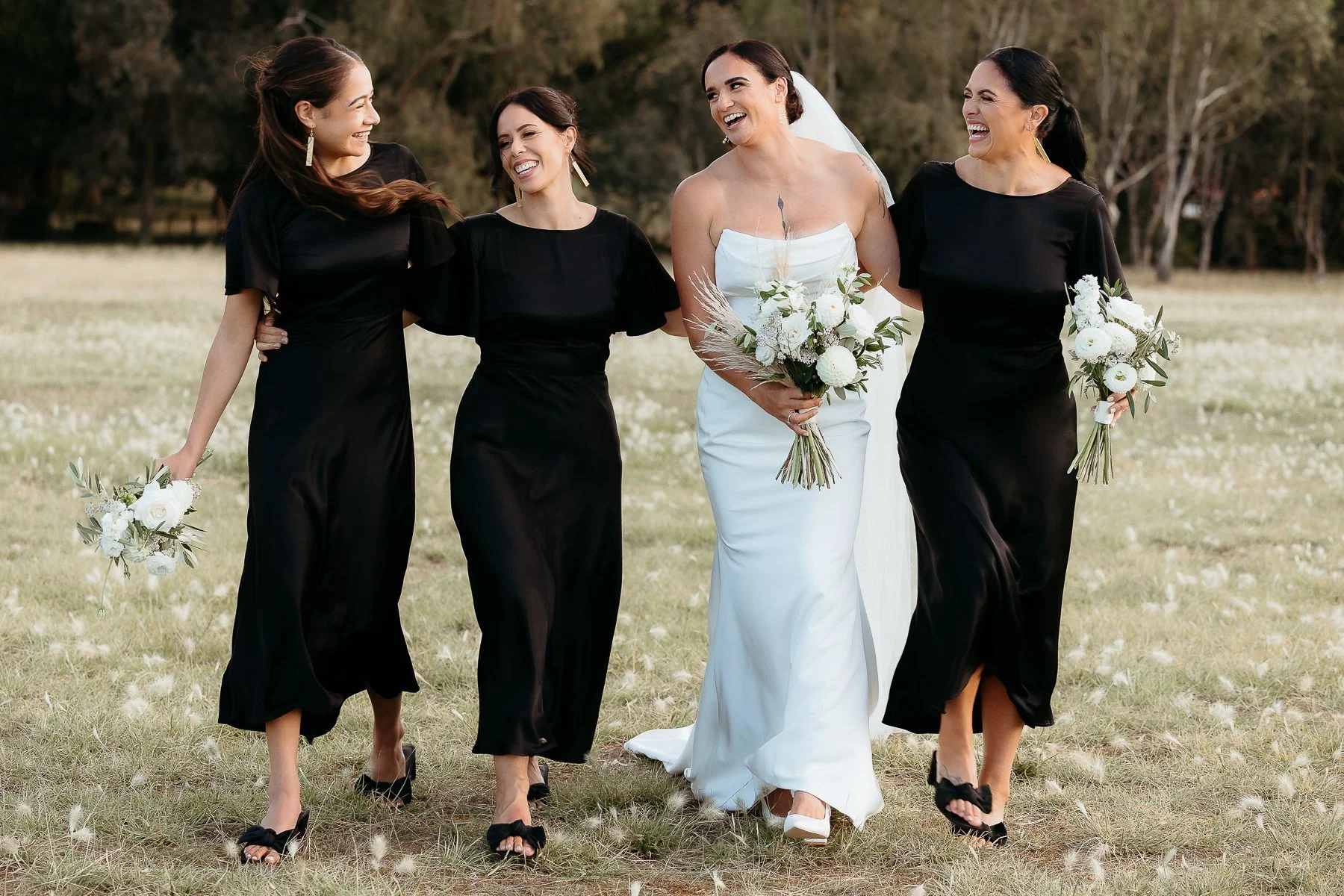 bride-laughing-with-bridesmaids-at-hawkes-bay-wedding