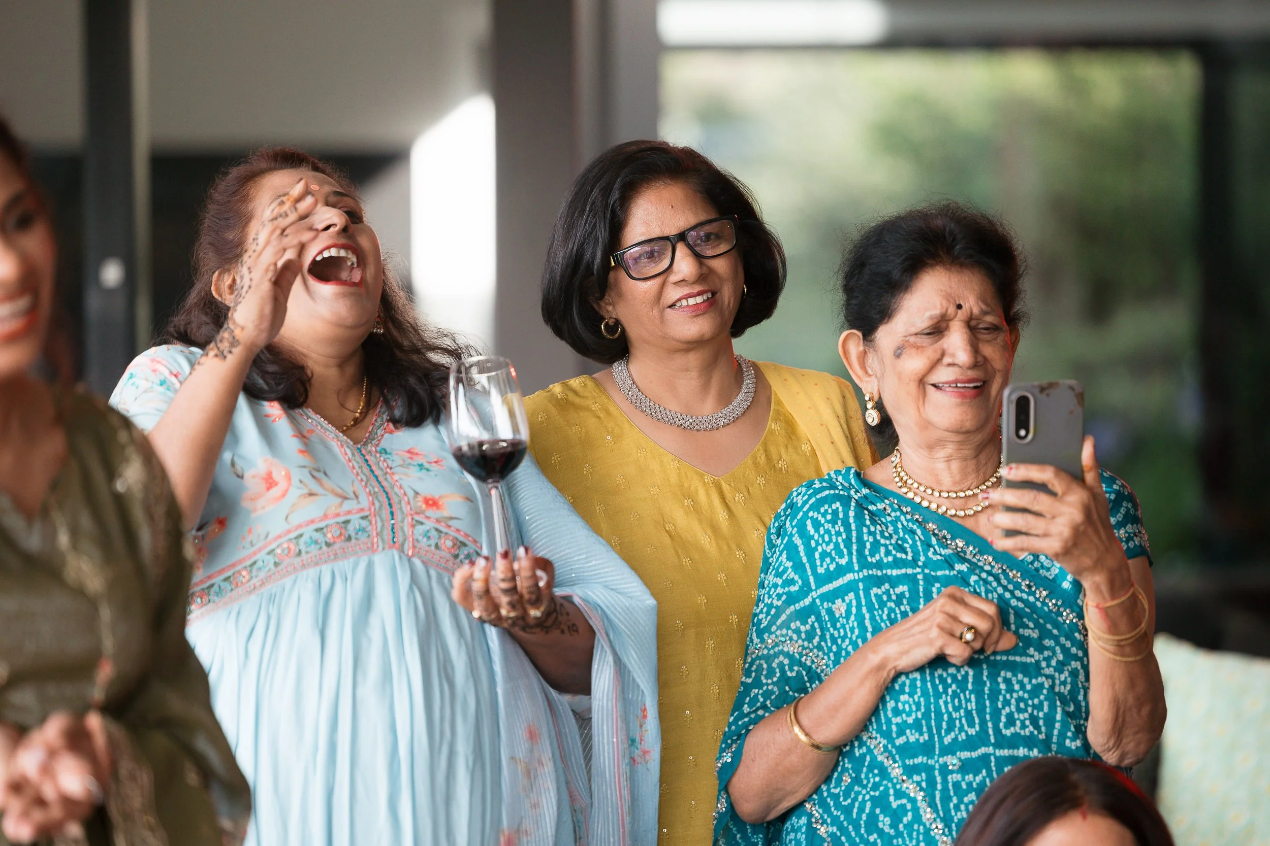 family-laughing-at-a-small-indian-wedding-nz