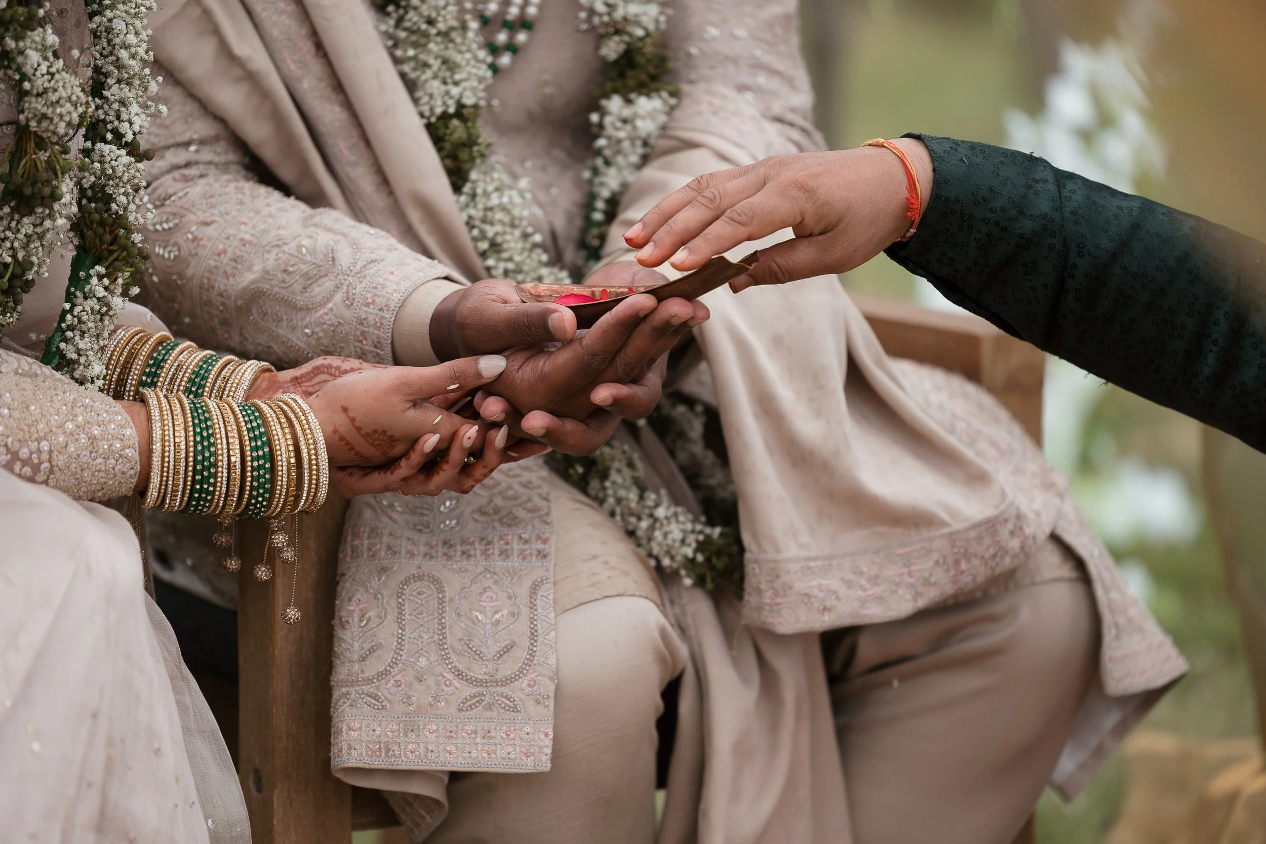 Close-up-of-hands-pheras-indian-wedding-ceremony