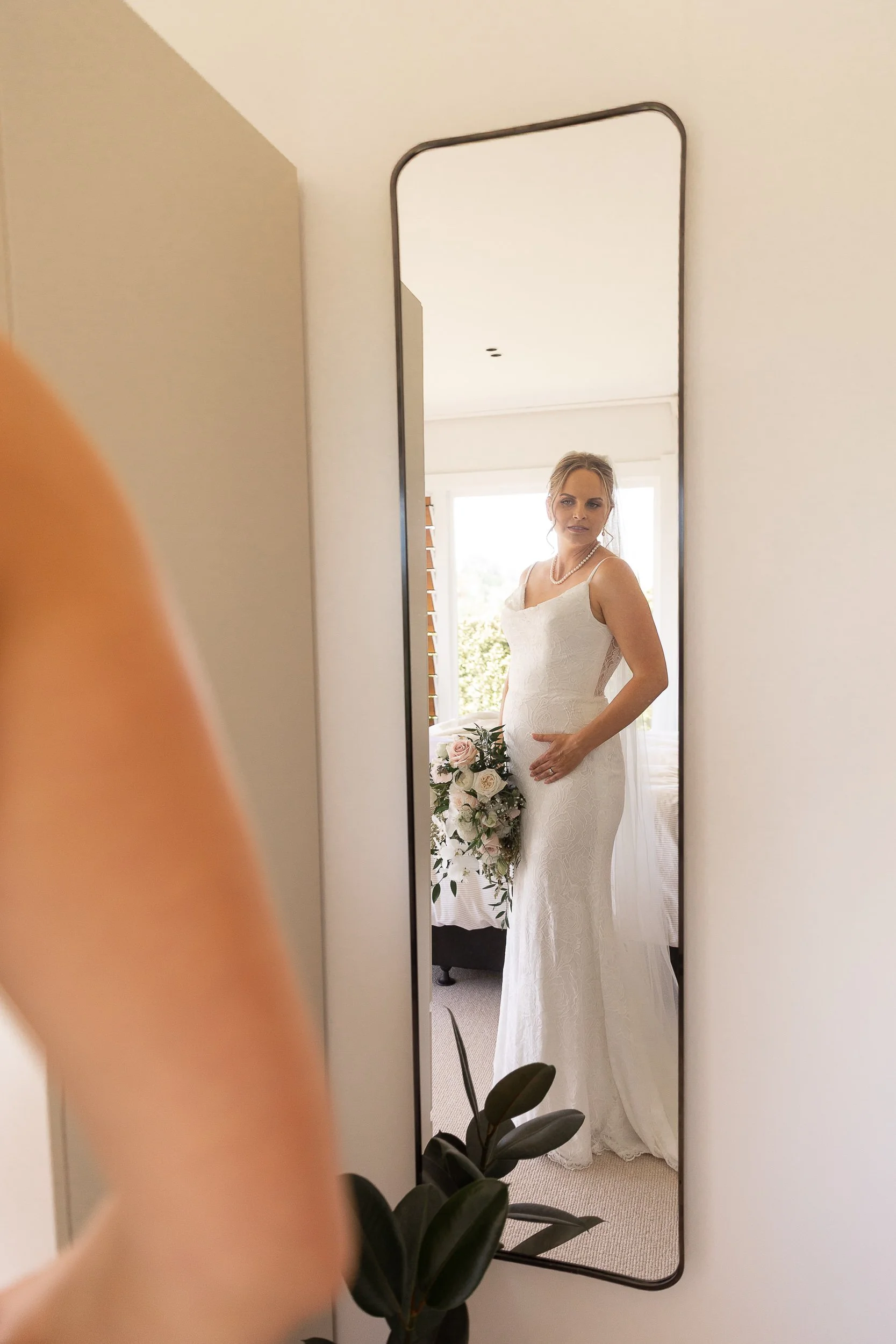 bride-looks-in-mirror-hawkes-bay-photographer