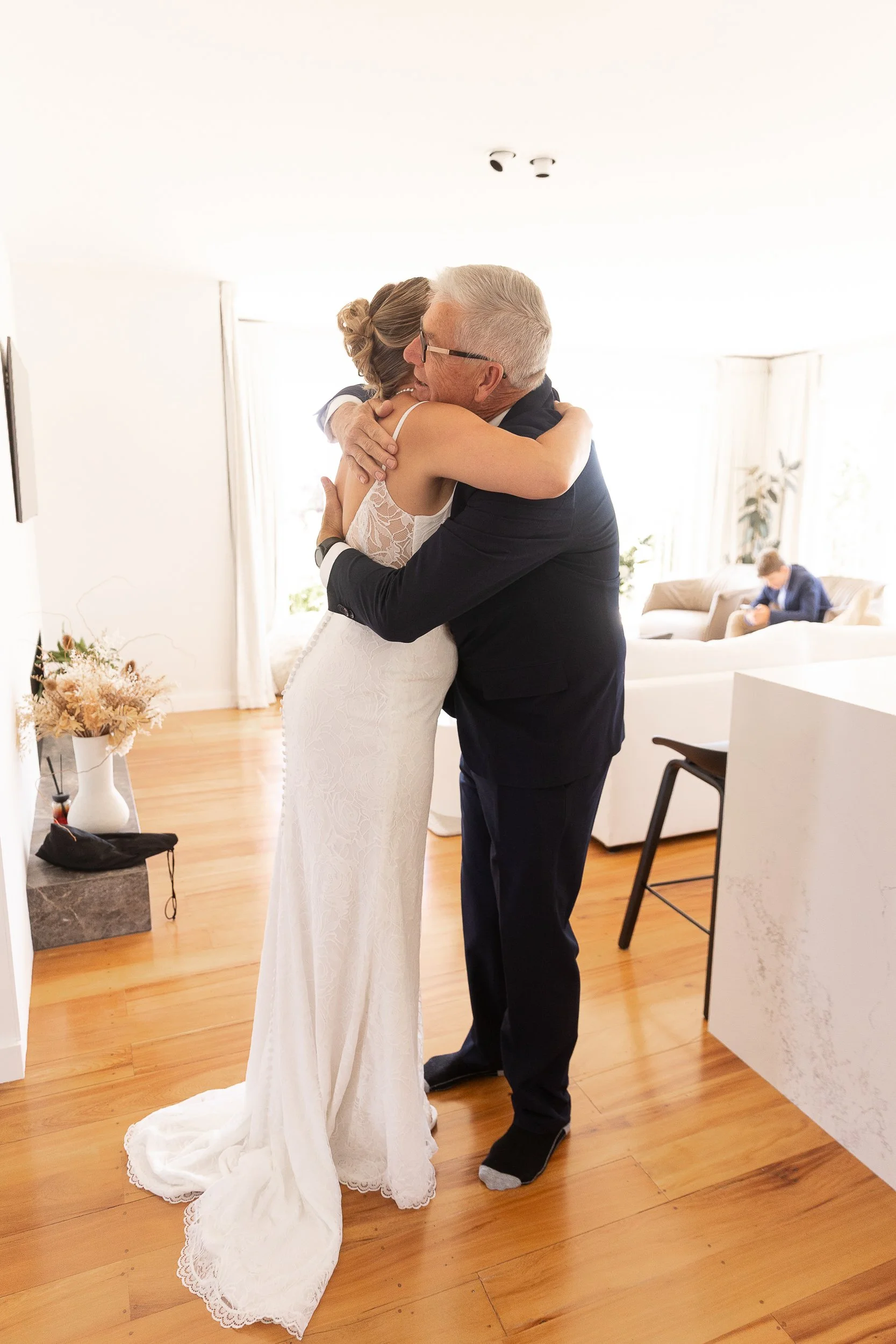 man-hugs-bride-napier-photographer