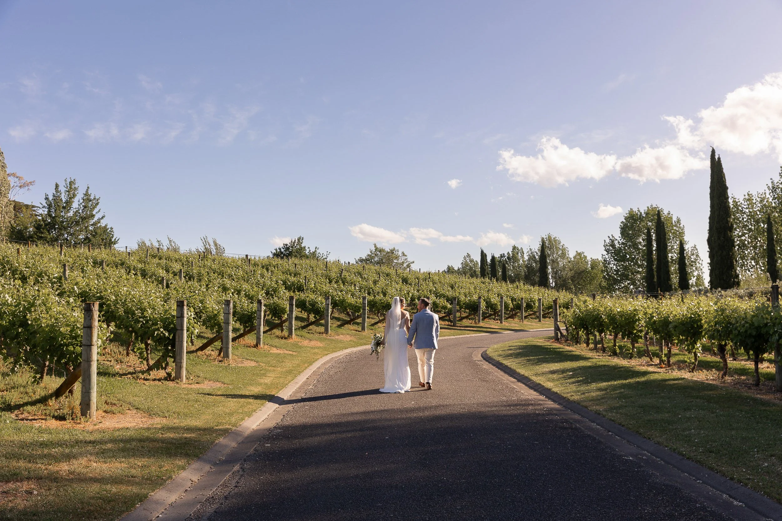 couple-walking-through-hawkesbay-vineyard-nz