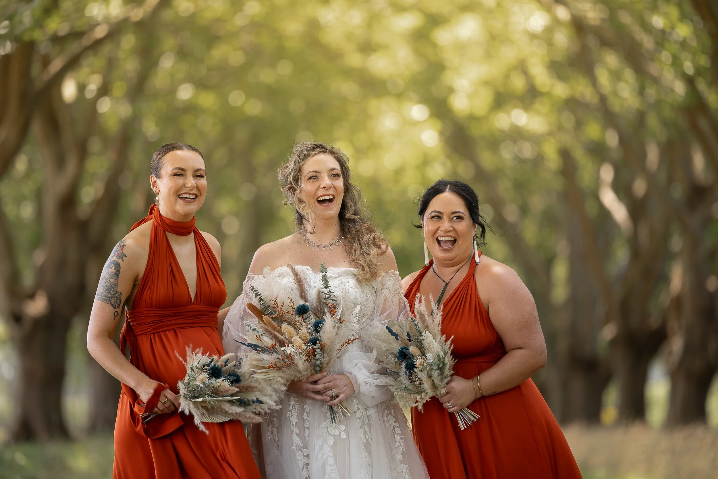 bride-and-bridesmaids-laughing-by-napier-wedding-photographer