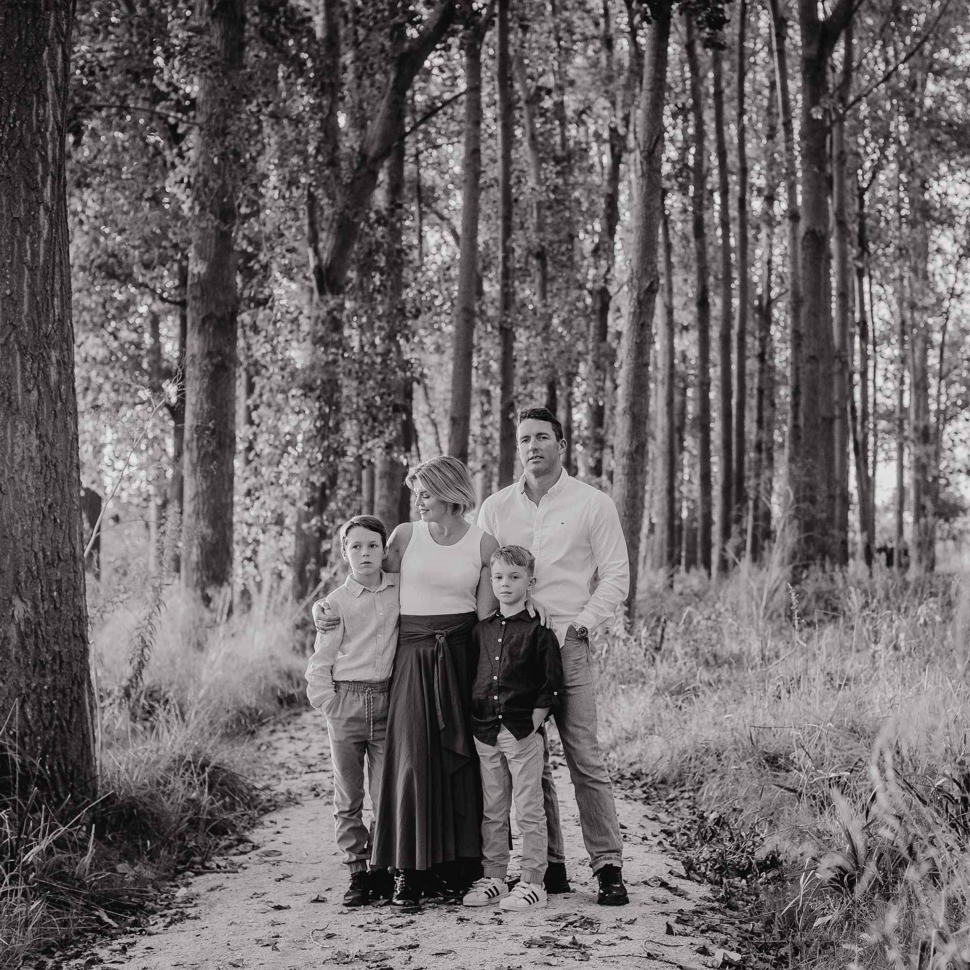 Eva Bradley, top Hawke's Bay wedding and family photographer, stands with her husband and two children at her home in Napier, Hawkes Bay