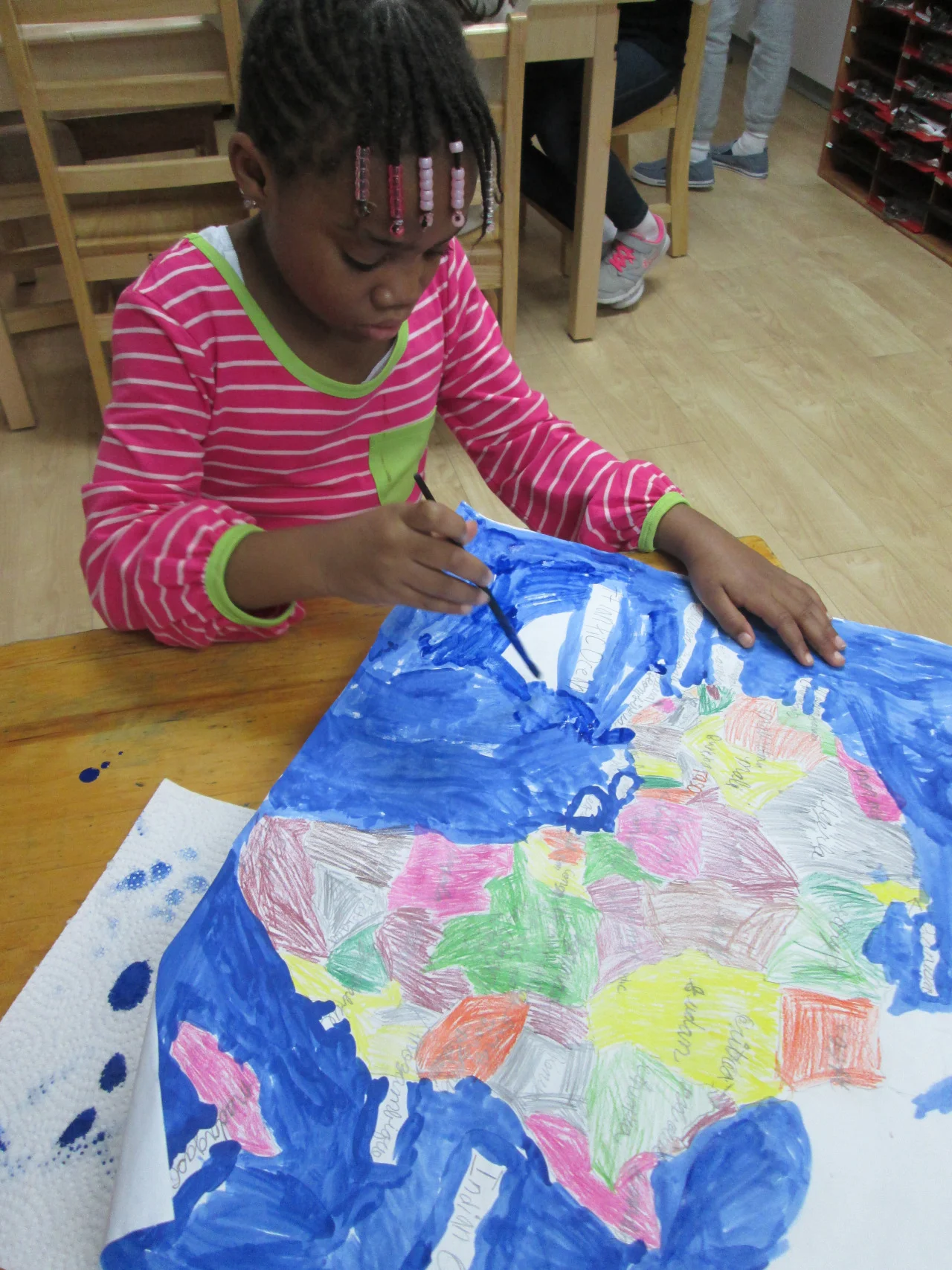 Lower Elementary East students continued to study the
continent of Africa. Before painting, a
first grade student traced and labeled the countries, labeled each
corresponding capital and identified other elements of her map, then completed
the final touches.